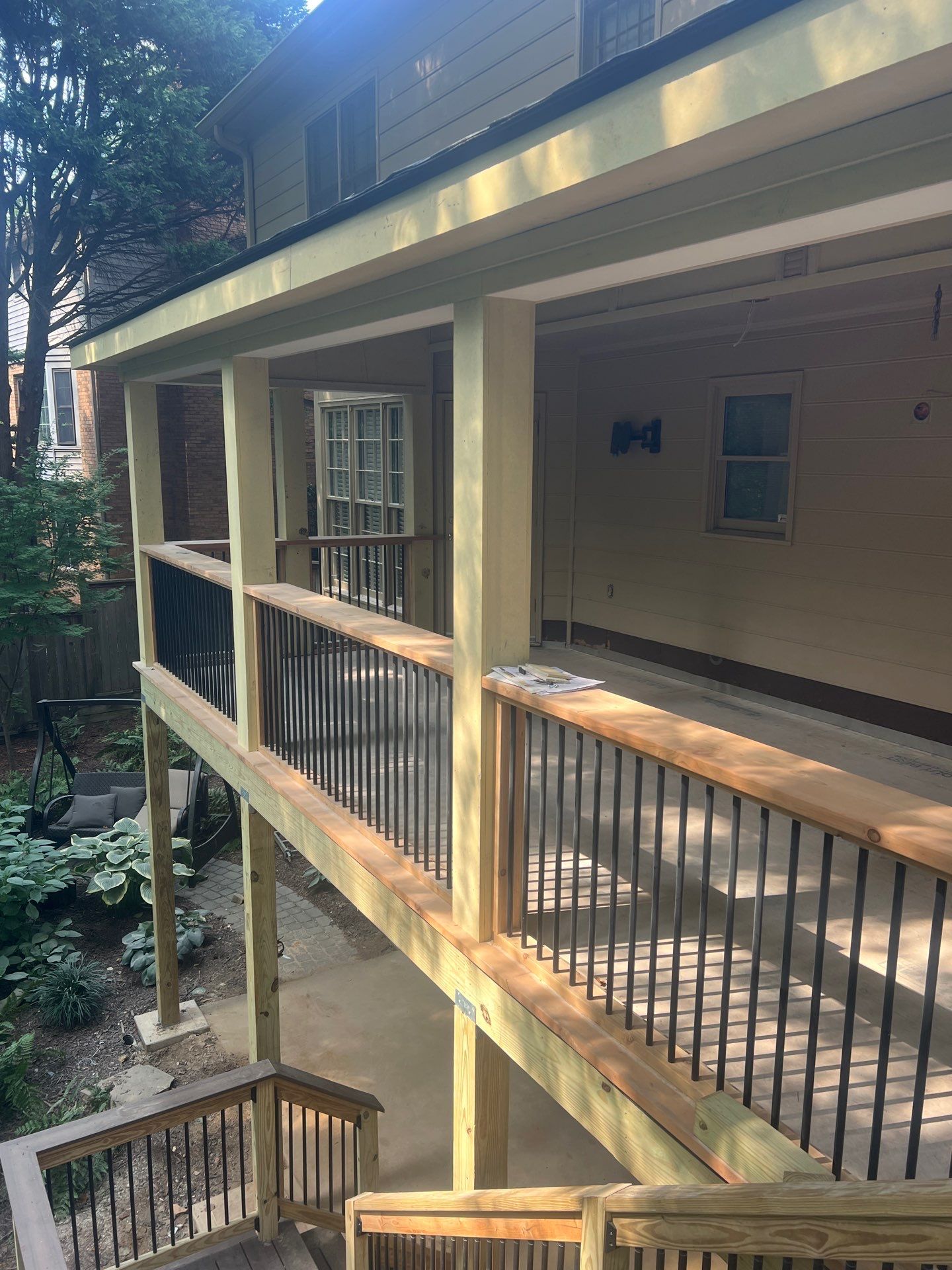Deckorators Voyage Deck and Shed Style Covered Porch Build with Drink Rail by Nelson Exteriors 