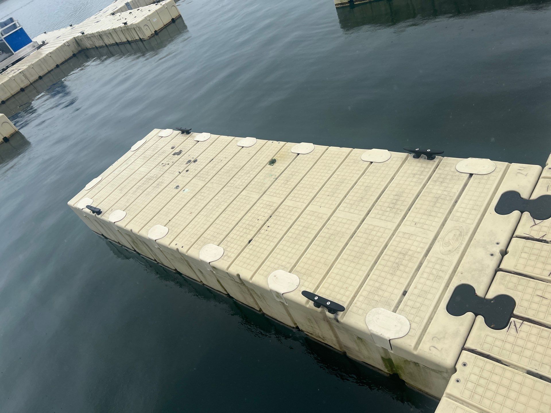 Power washing of floating dock by Northern Power Washing LLC.