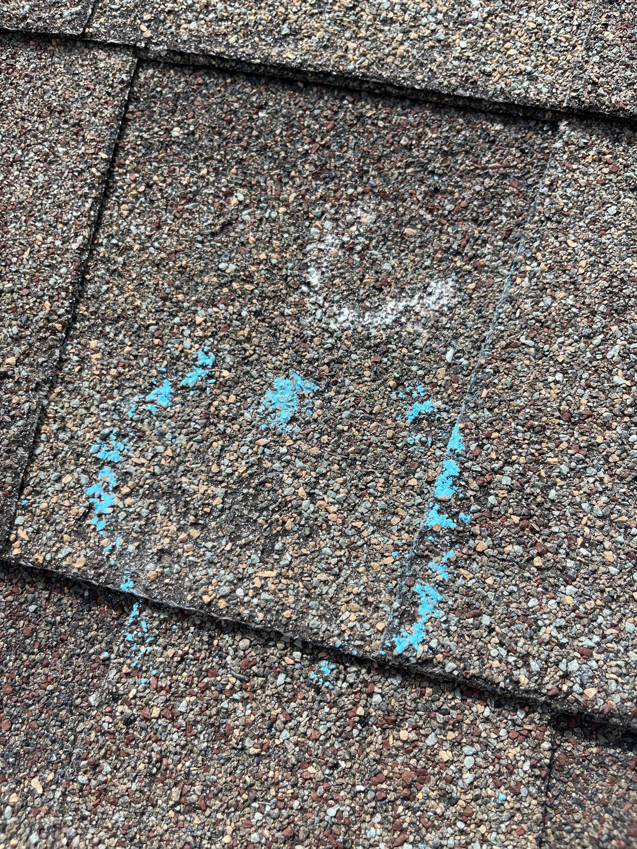 Hail Damage on a Roofing System by Icon Roofing And Construction 