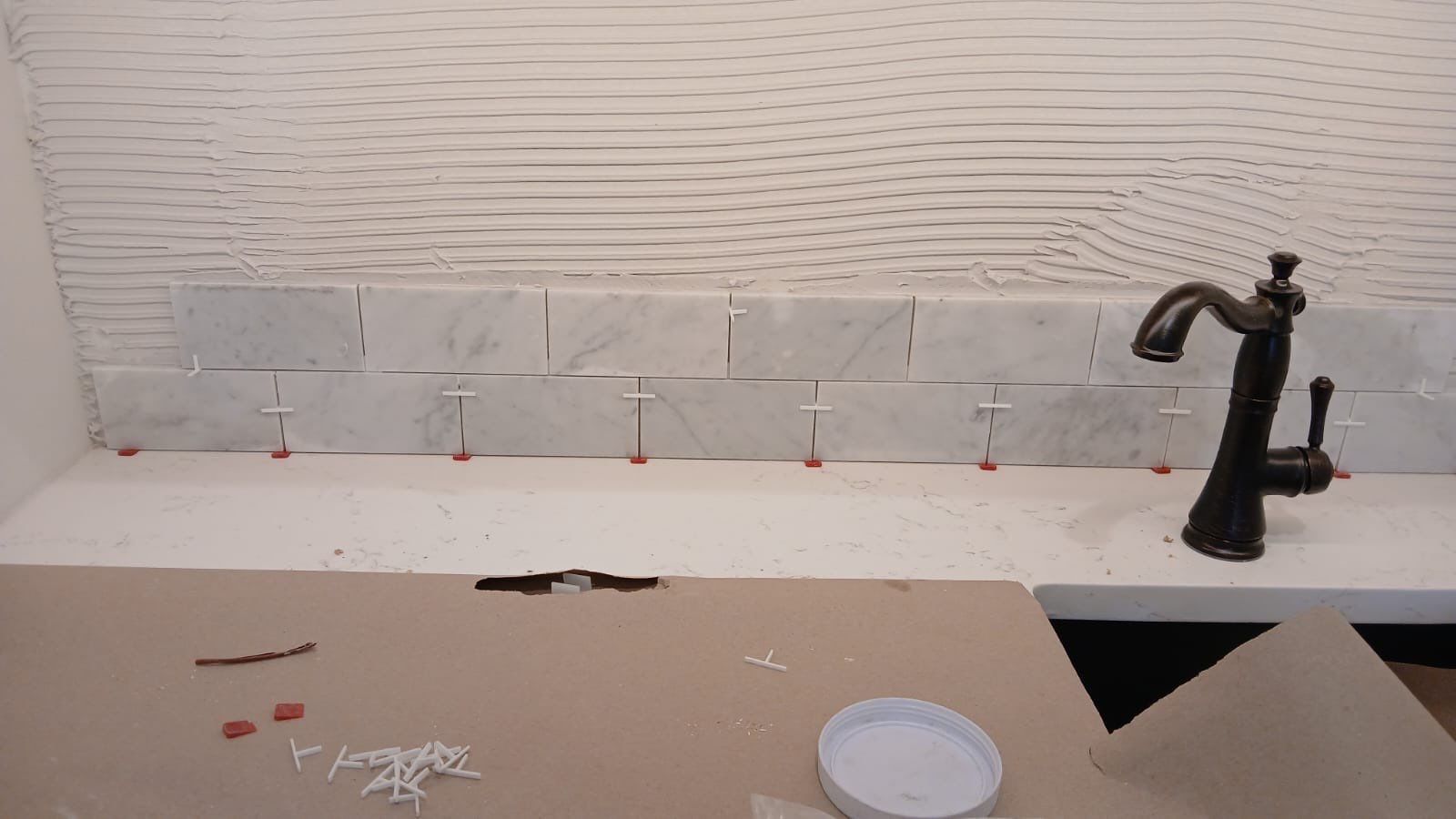 Kitchen and Bathroom Remodel Featuring Custom Stone and Tile in Mico by Mena stone surfaces