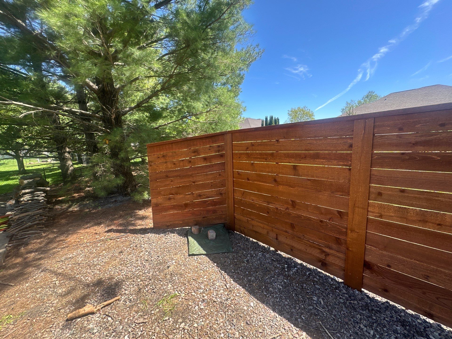 Horizontal Stained Wood Privacy Fence Installation in Waterloo by Perfect Picket Fence and Stain
