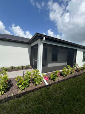 Dark Bronze Gutters and White Downspouts in Sarasota FL