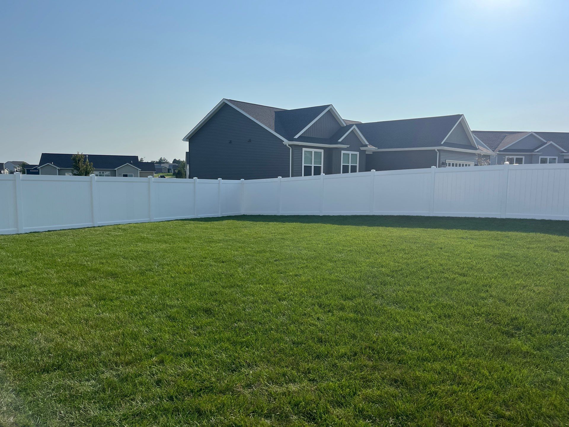 White Vinyl Privacy Fence Installation With Double Gates in Waterloo by Perfect Picket Fence and Stain