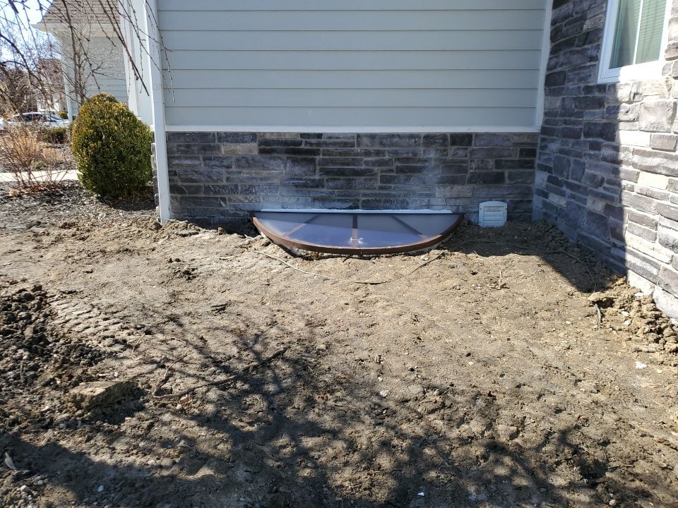 Egress Window Installation using Rockwell Egress Fiberglass Egress Window Well by Toledo Basement Repair 