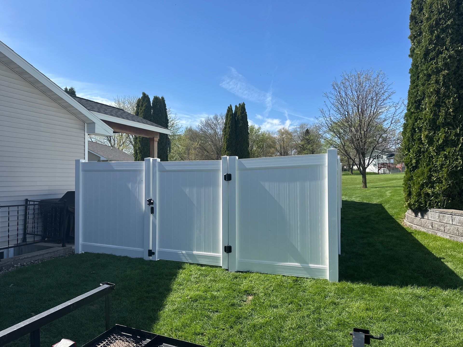 White Vinyl Privacy Fence Installation in Raymond, Iowa by Perfect Picket Fence and Stain