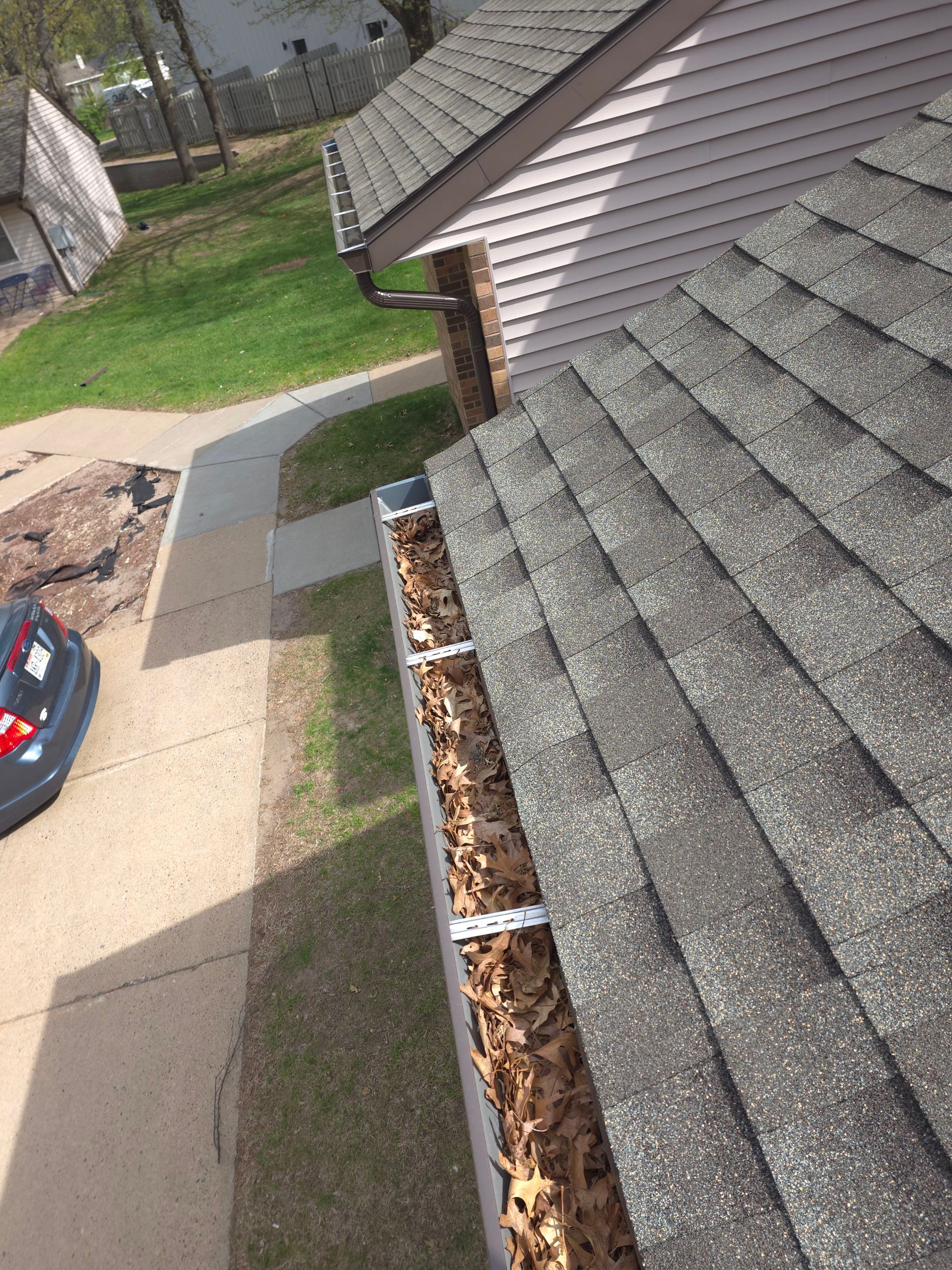 Commercial gutter cleaning Eau Claire before photo with filled gutters