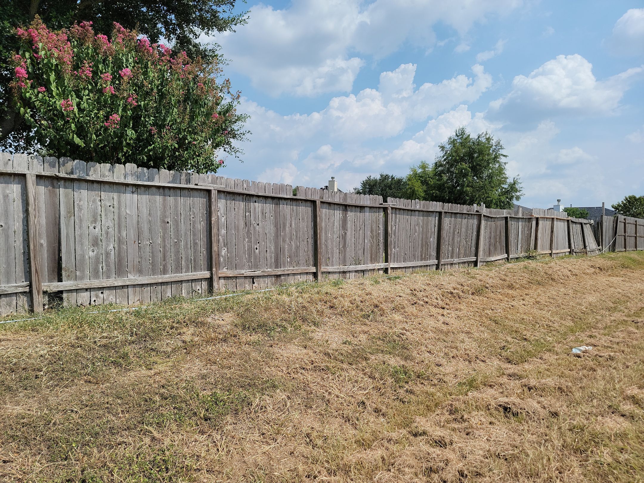 Beautiful Wood fence with metal posts by Tim's Fences
