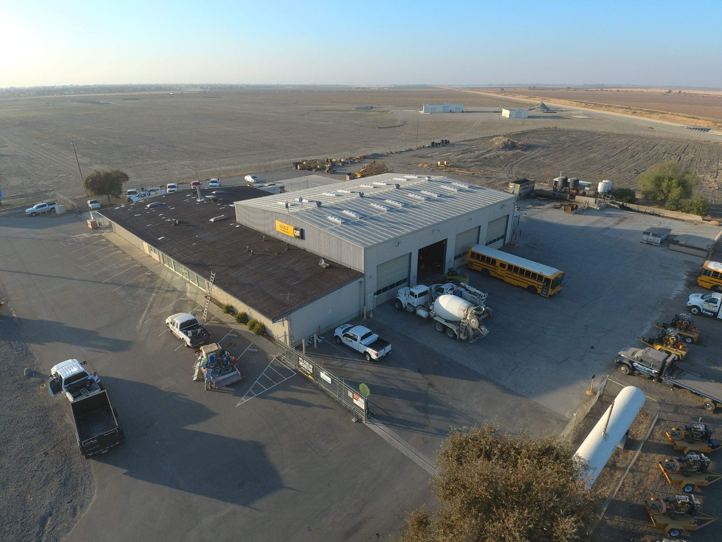 Metal roof restoration on commercial roof using Conklin Benchmark/ PUMA XL acrylic coatings over metal and foam by Straight Edge Roofing Inc