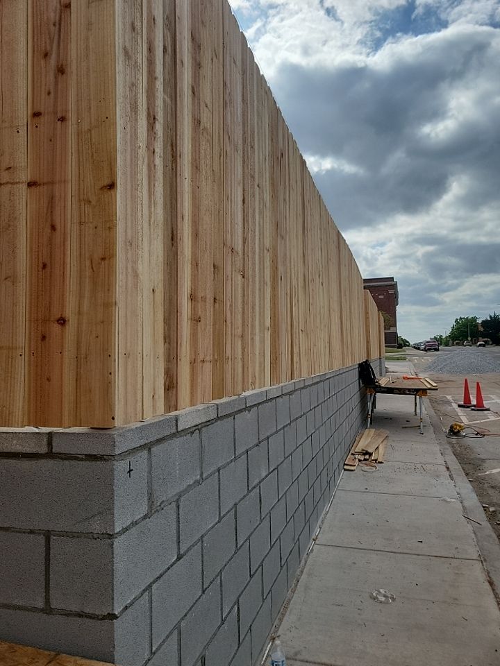 Cedar Fence using Cedar Pickets and Metal Poles by Clays Services Inc