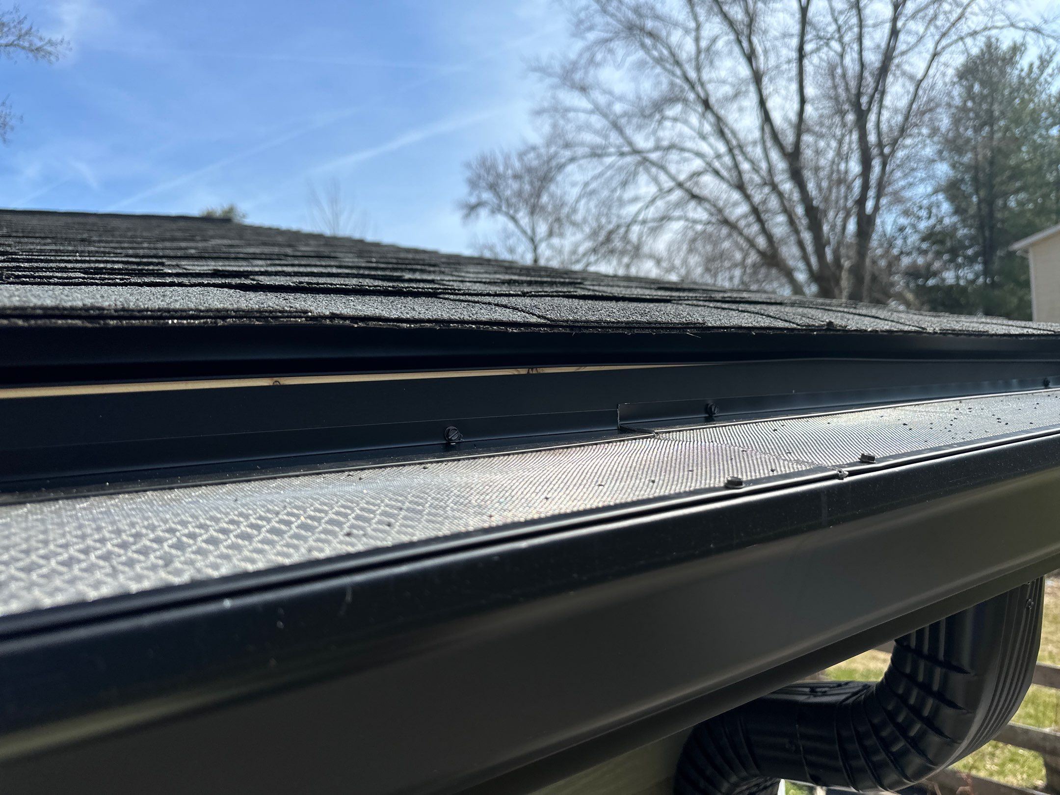 Blacked Out Gutters / Gutter Guards by American Home Contractors