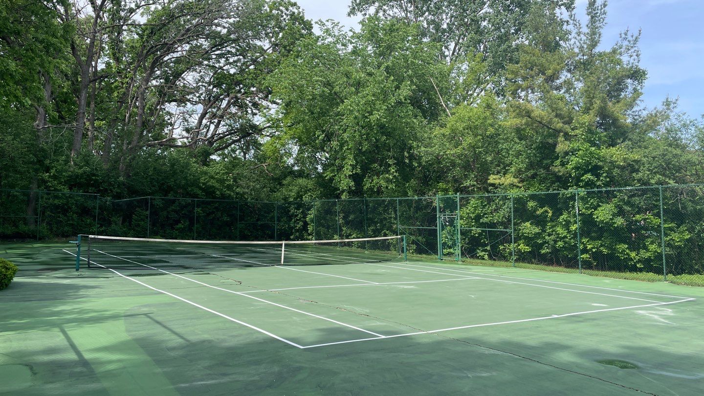 Tennis Court using Algaecide, soft wash soap by Northern Power Washing LLC.