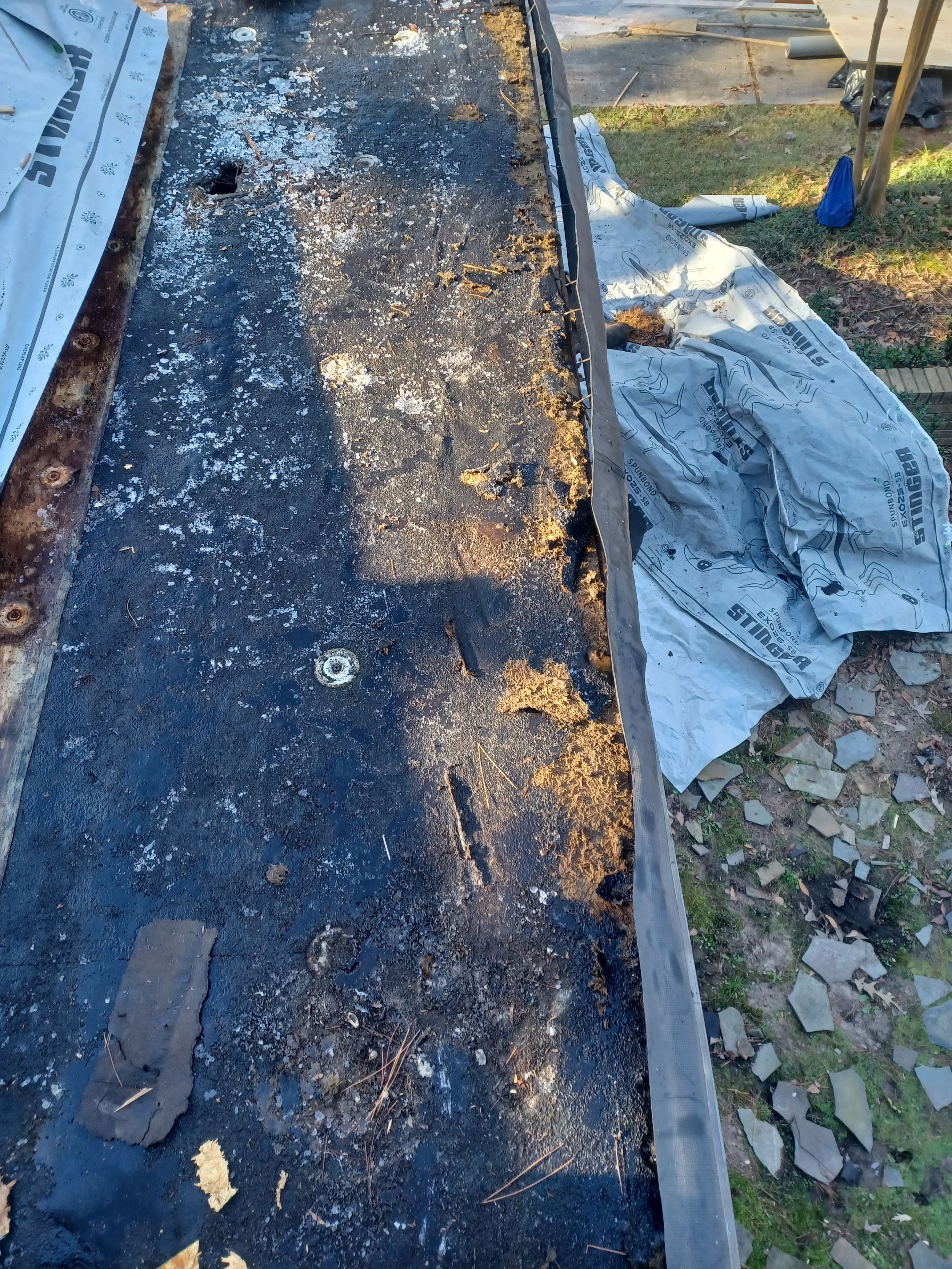 Residential Roofing Installation using PVC membrane and 24 gauge Standing Seam Metal by Hostetler Roofing