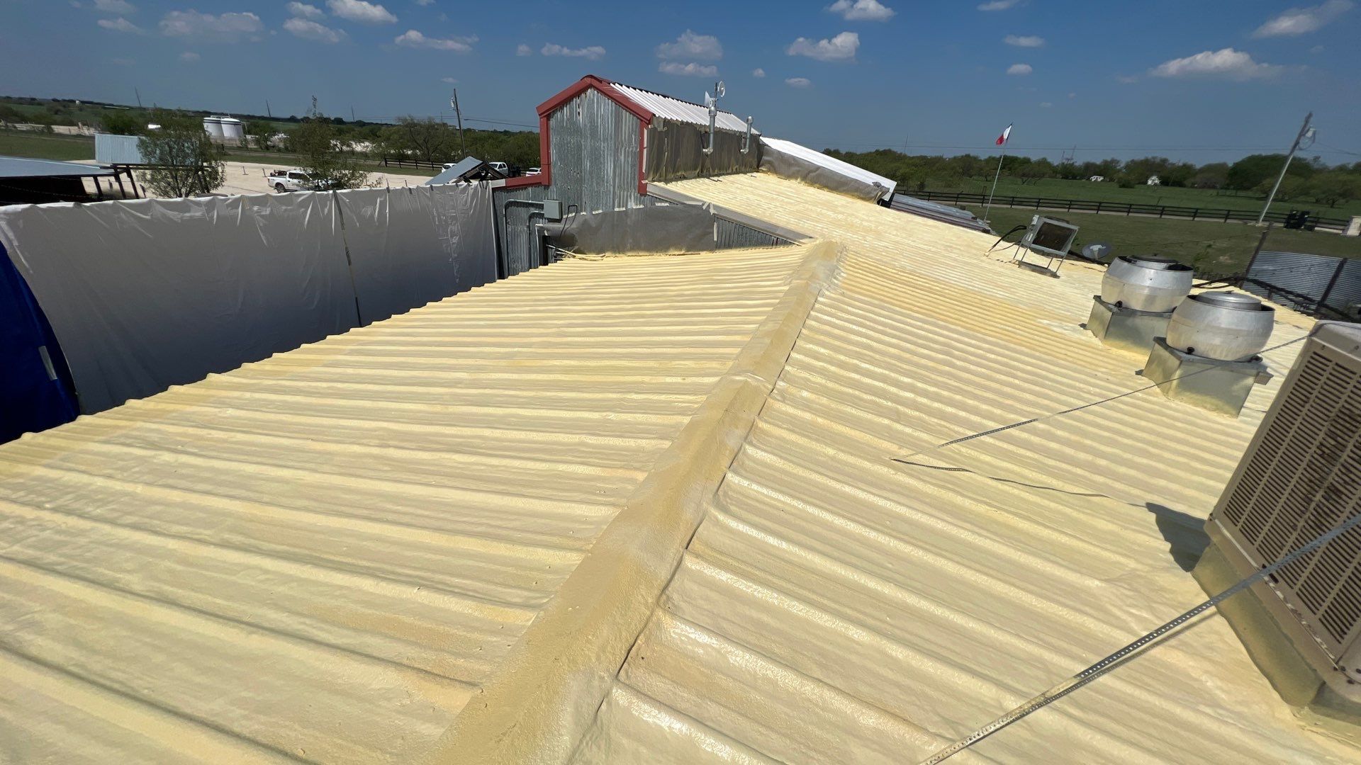 Commercial Roofing Repair using TRP #924 Eterna-Sil Premium Silicone Roof Coating by Harvey Roofing & Construction