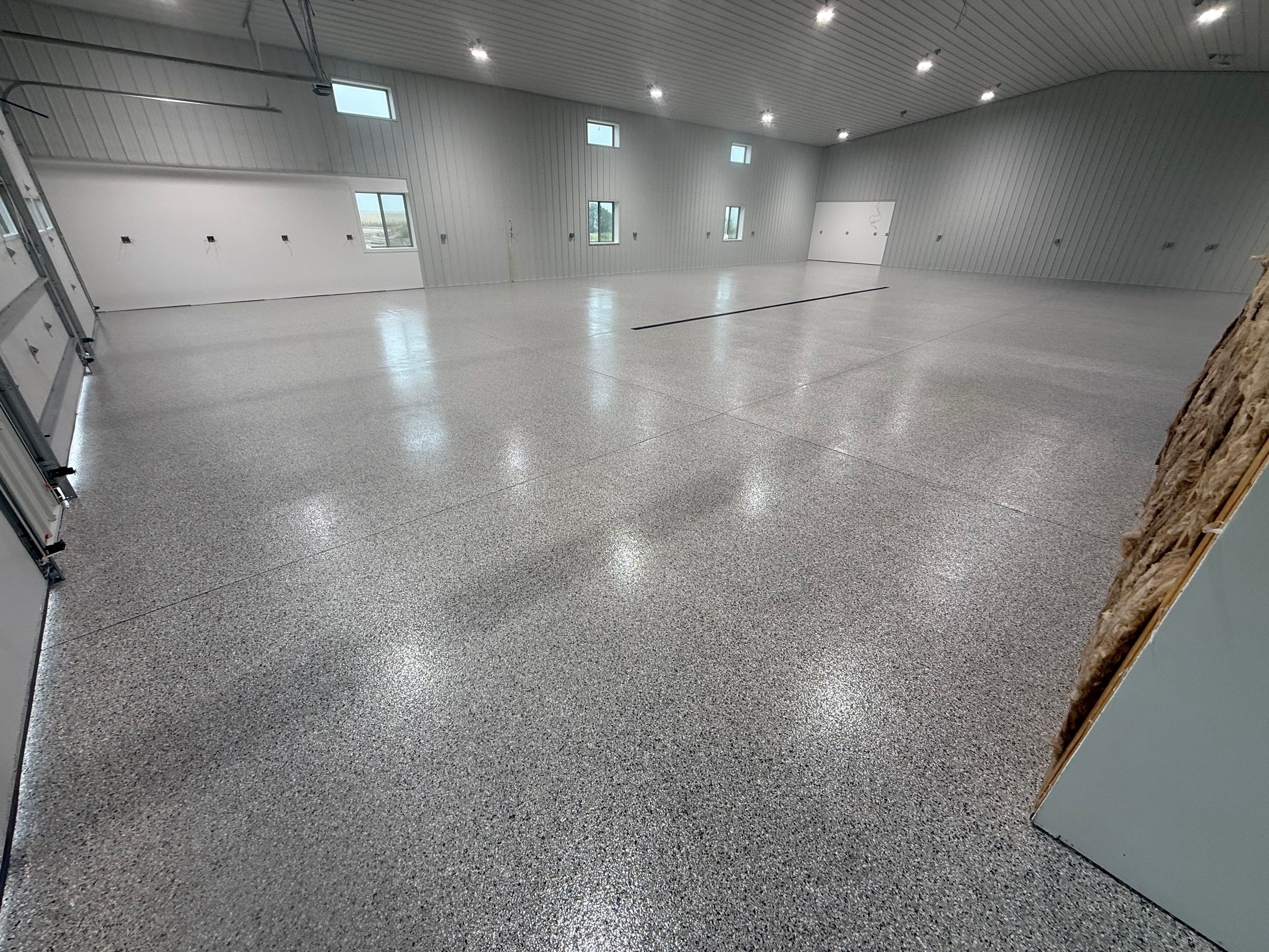 Custom Speckled Floor Coating for Large Montrose Shop by Select Painting, Coatings & Garage Cabinets