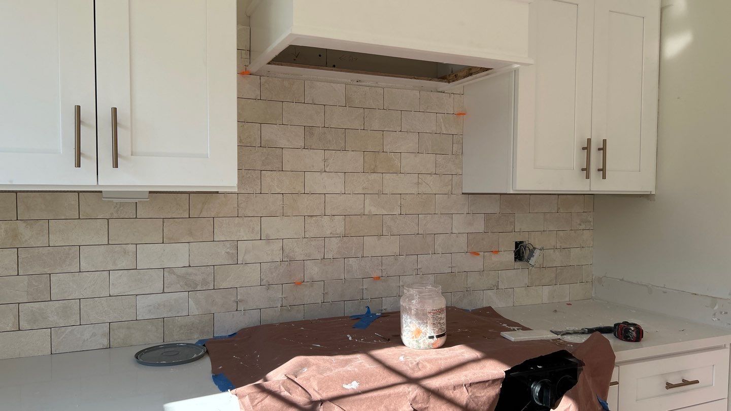 Lovely neutral backsplash  by Footprints Floors of Nashville