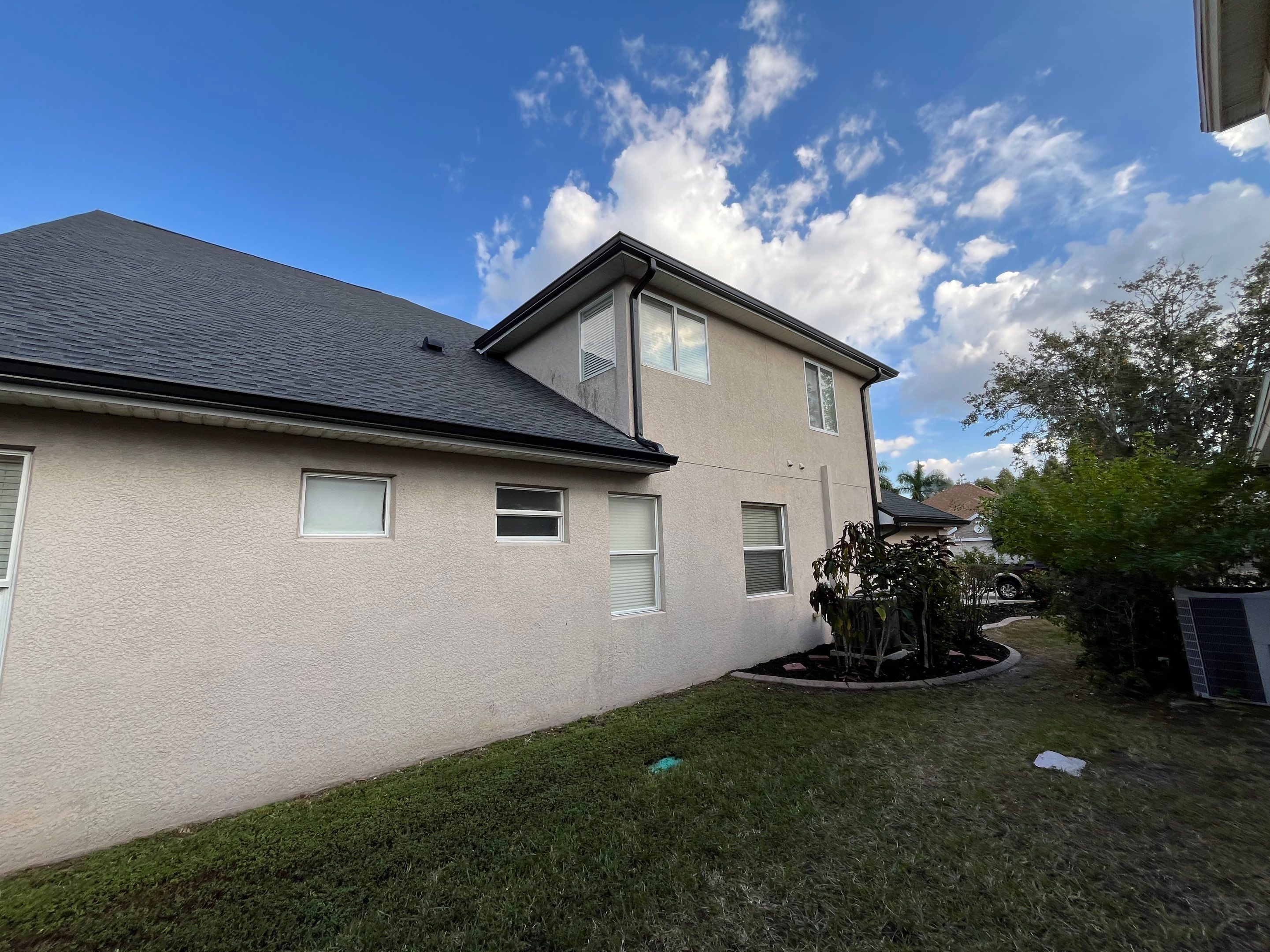 Black 6-inch Seamless Gutters for Modern Ellenton Homes FL by Gutter Professors