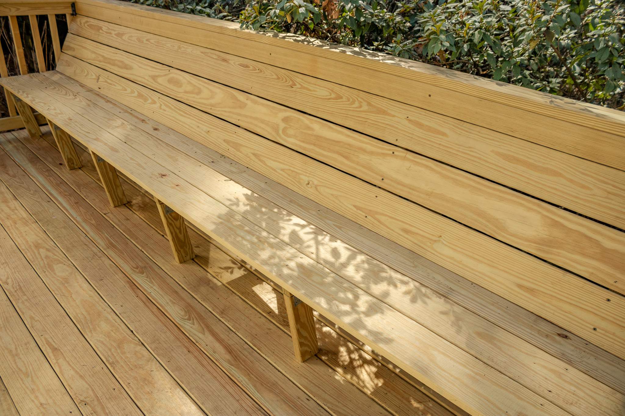 Deck Resurface with Wood Bench Install Using Pressure Treated Pine by Nelson Exteriors
