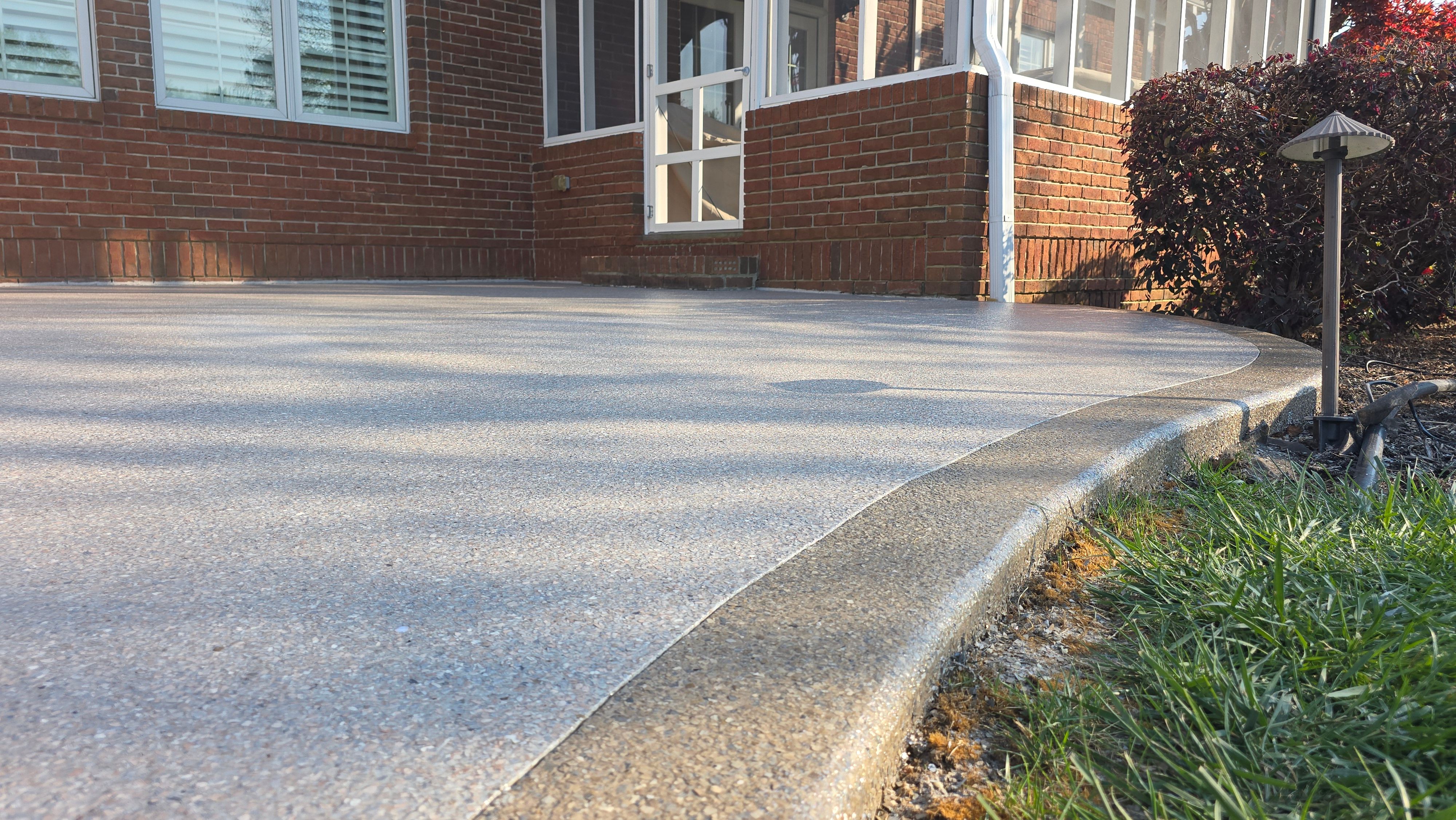 Patio in Pumice with Obsidian Border  by Elite Floor Solutions