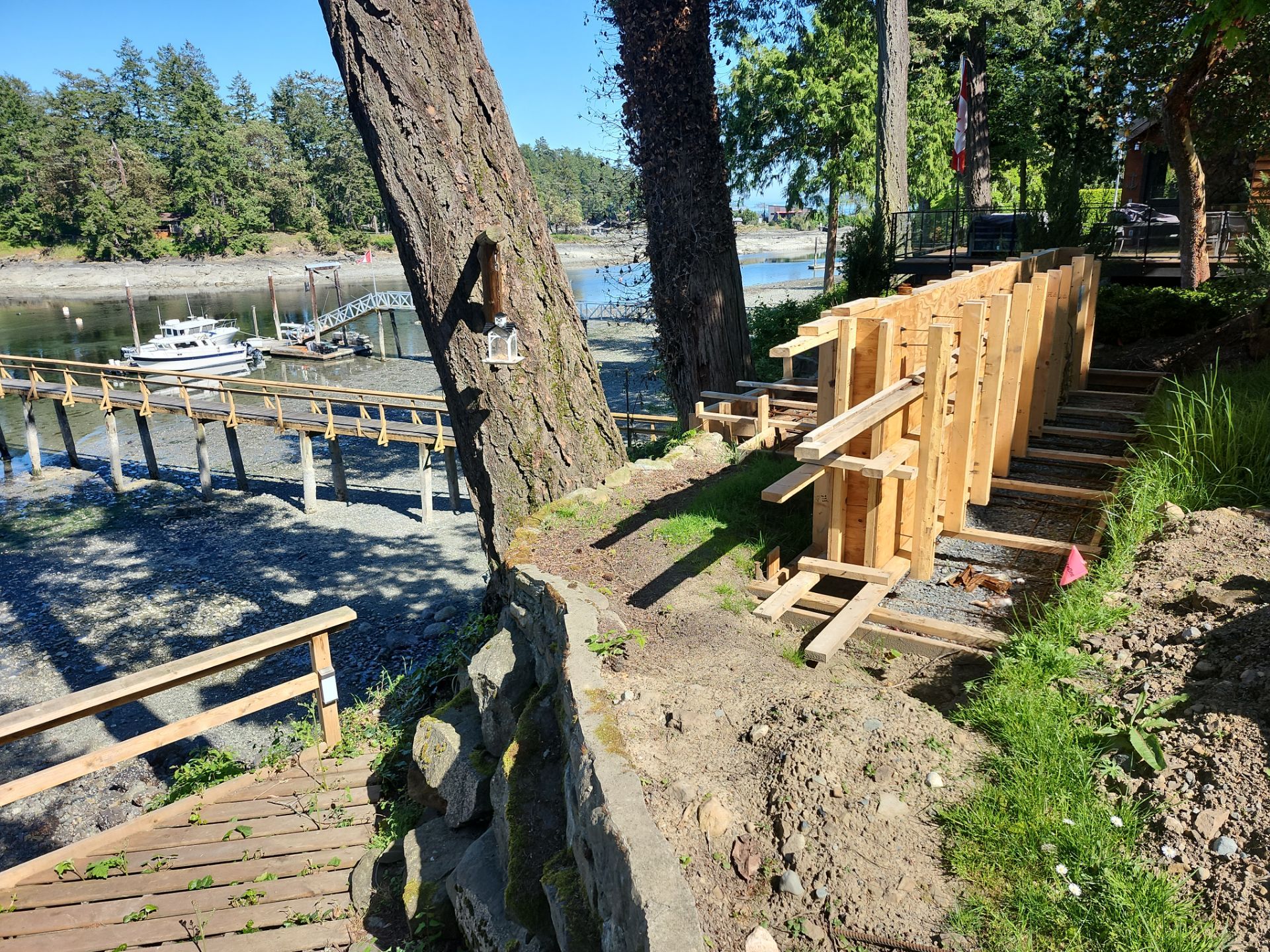 Coastal Landscape Restoration & Retaining Structure - In progress by Habanero Garden and Exterior Care