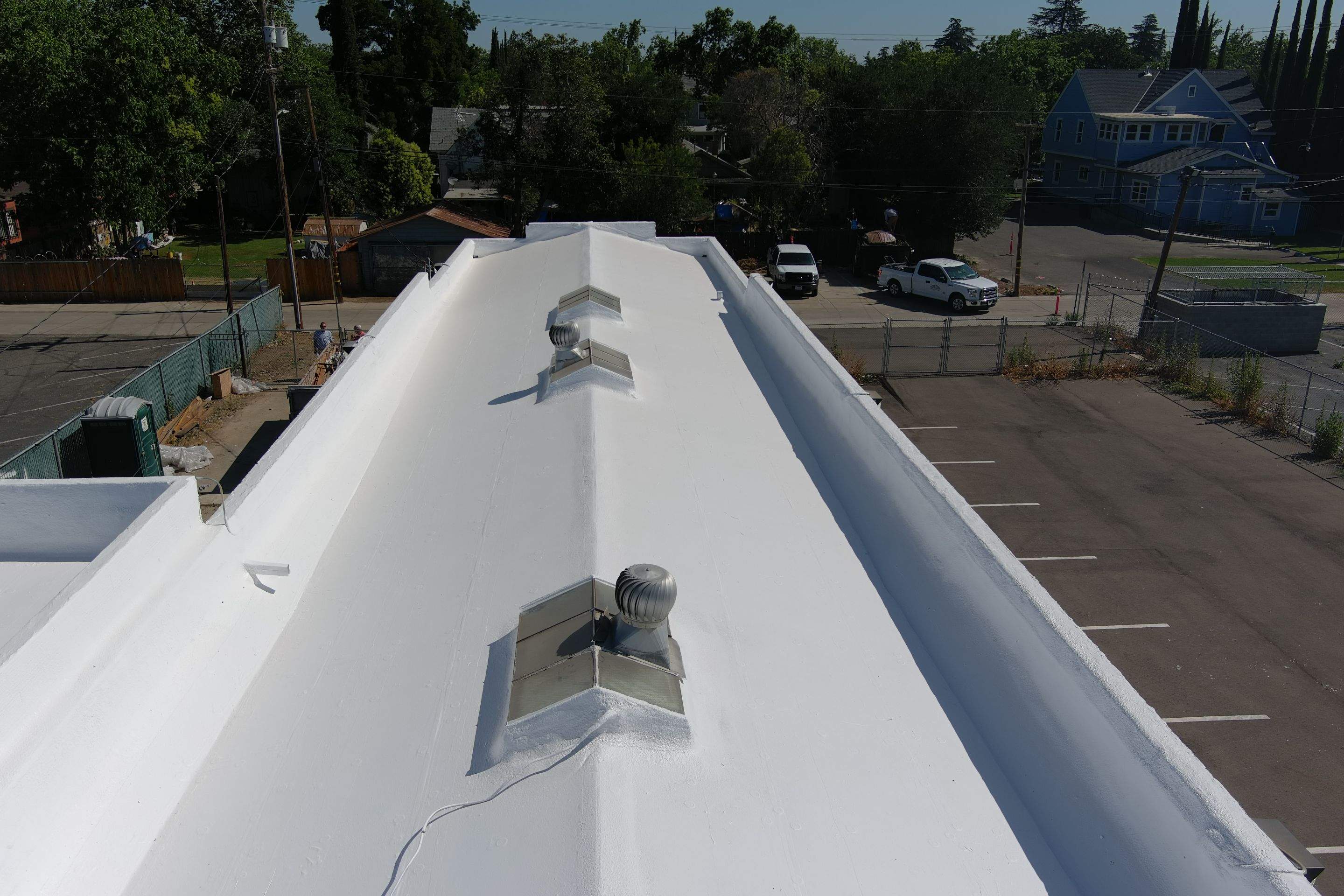 Commercial Roofing Installation using Conklin BenchPly system with PUMA top coat (imbedded fabric system) by Straight Edge Roofing Inc