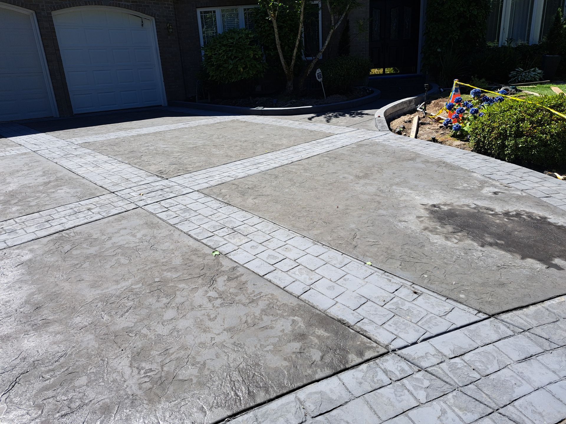 Multi-color Stamped & Sealed Concrete Driveway Renovation | Mukilteo by Jireh Asphalt & Concrete Inc