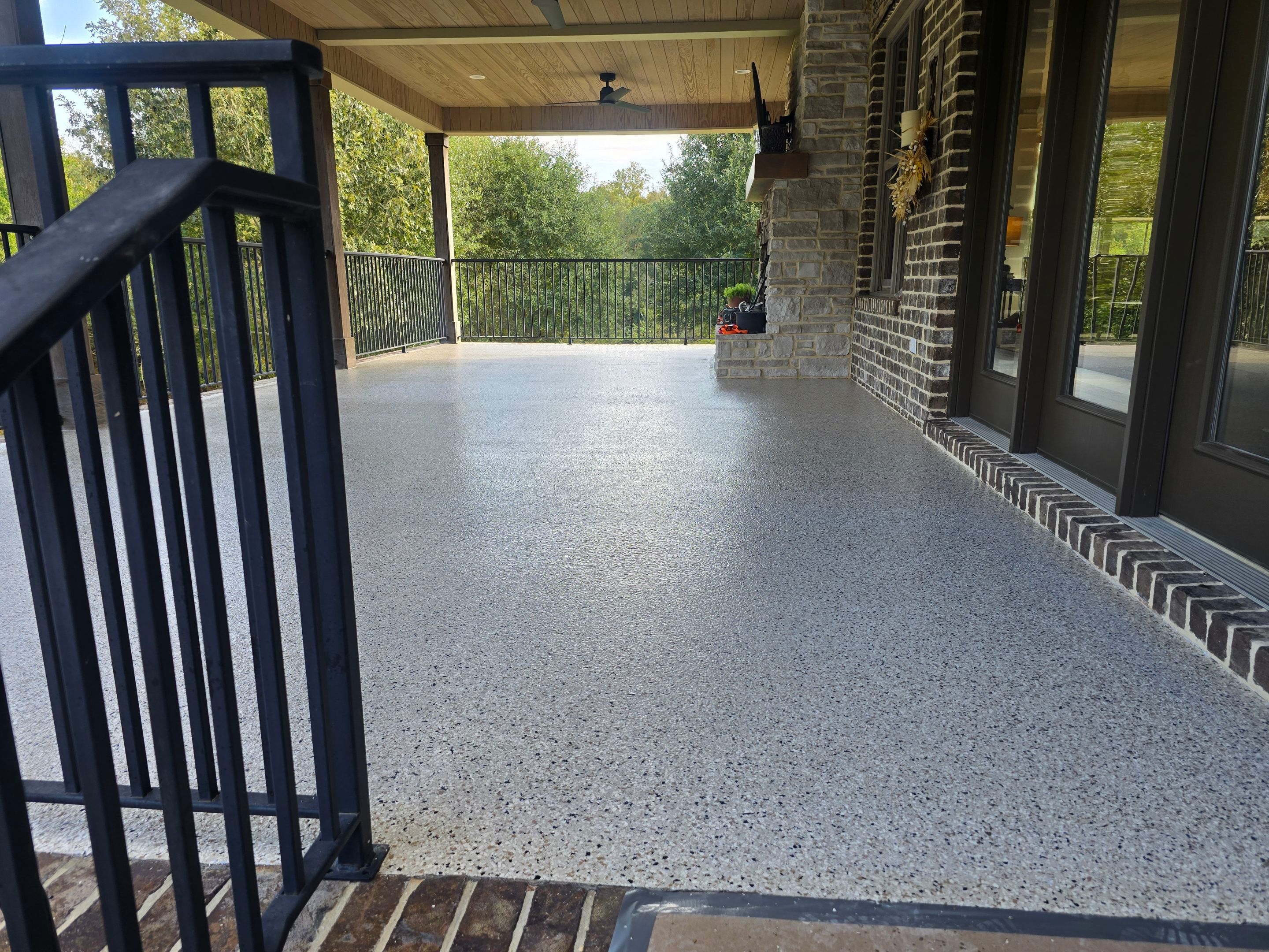 Garage & Porch Using Creekbed & Shoreline by Elite Floor Solutions