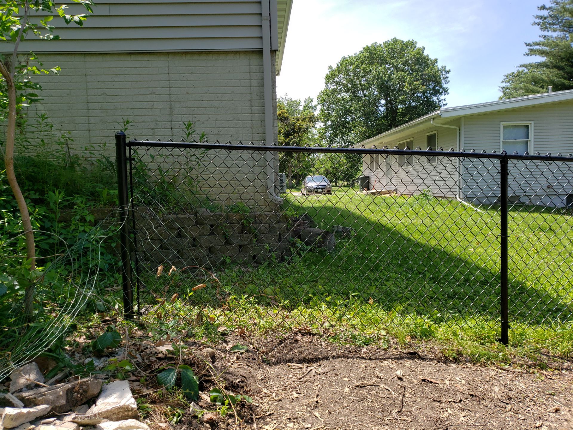 Black Chain Link Fence Installation in Cedar Falls by Perfect Picket Fence and Stain