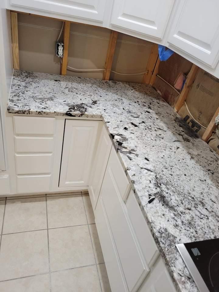 Kitchen countertops using White Normandy Granite by Mena stone surfaces