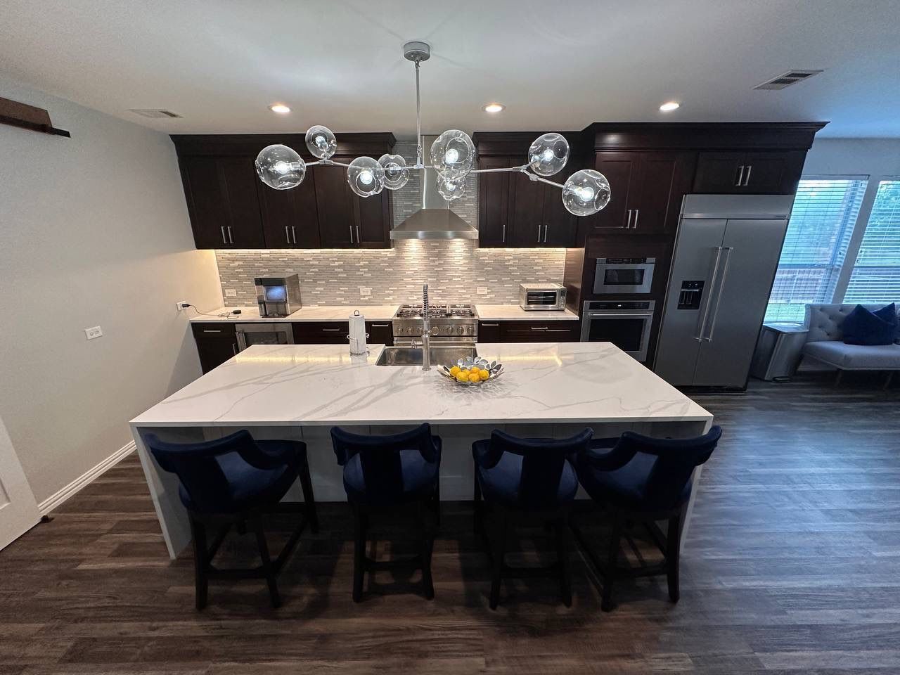 Kitchen Remodel using Calacata Quartz by Construction Nation Group