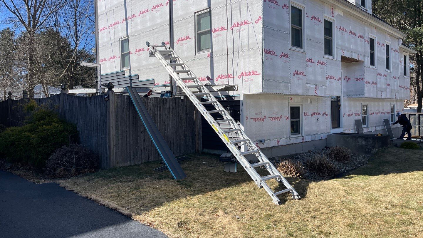 Complete Exterior Renovation with New Siding & Gutters   by Sensible Home Solutions