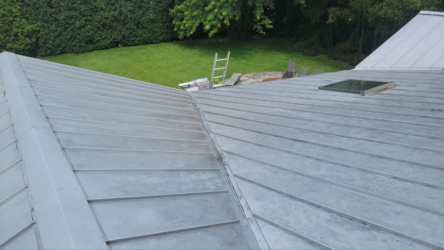 roof washing using Algaecide, soft wash soap by Northern Power Washing LLC.