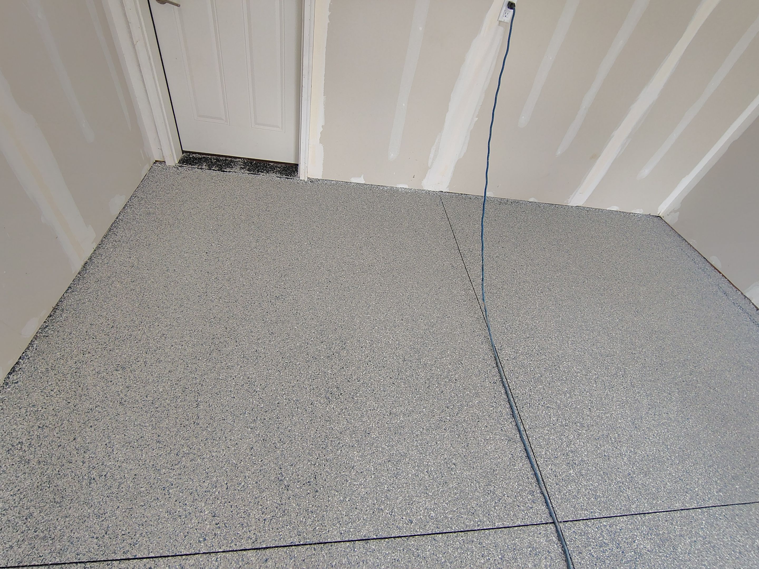 Custom Epoxy Garage Floor Coating Installation in Sioux Falls by Select Painting, Coatings & Garage Cabinets