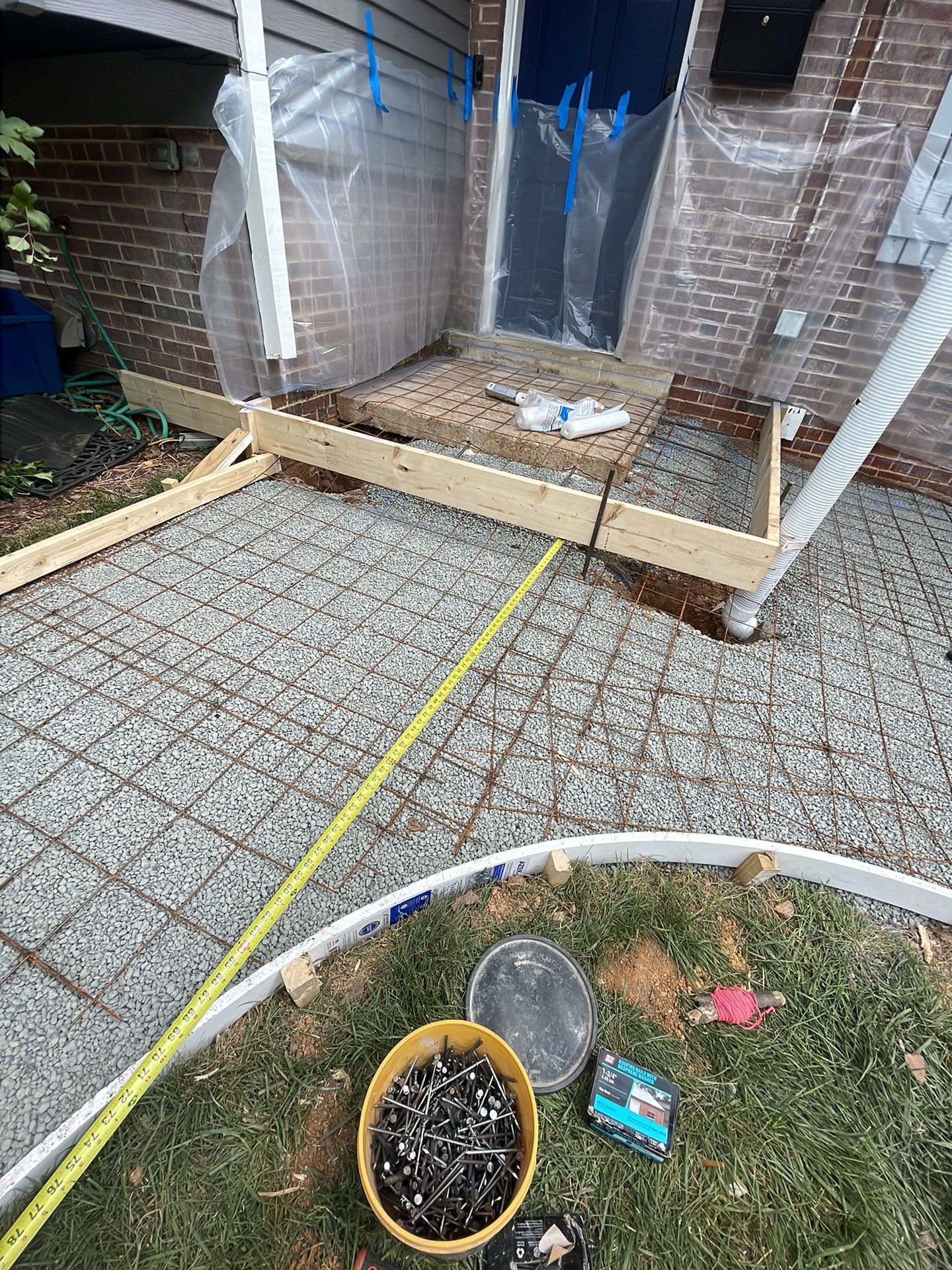 New walkway with stairs and a new front porch by Fairfax Contractors, LLC