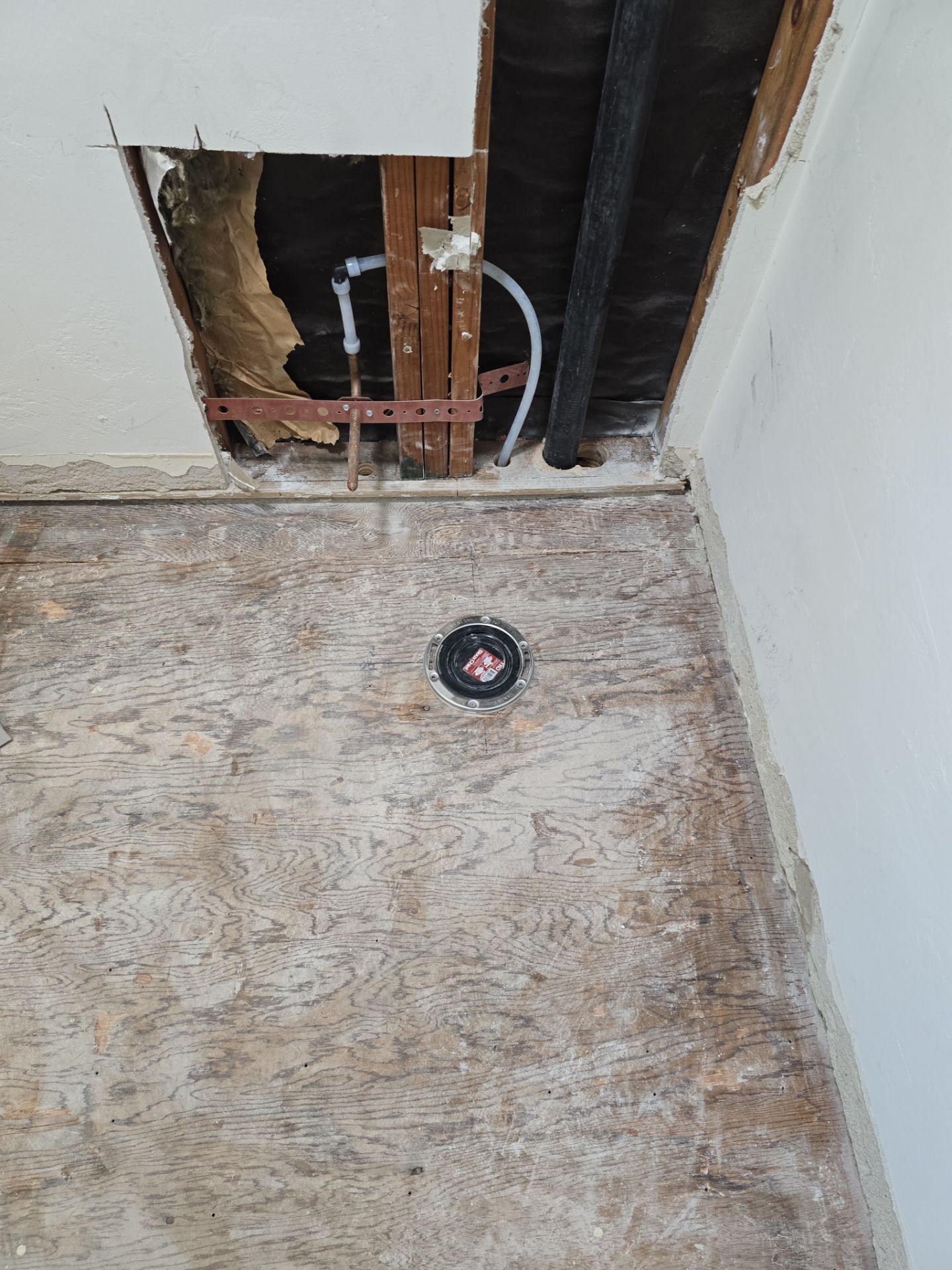 Installation of New Tall Black Piping (Wall to Ceiling) & Underground Piping by Us Plumbing