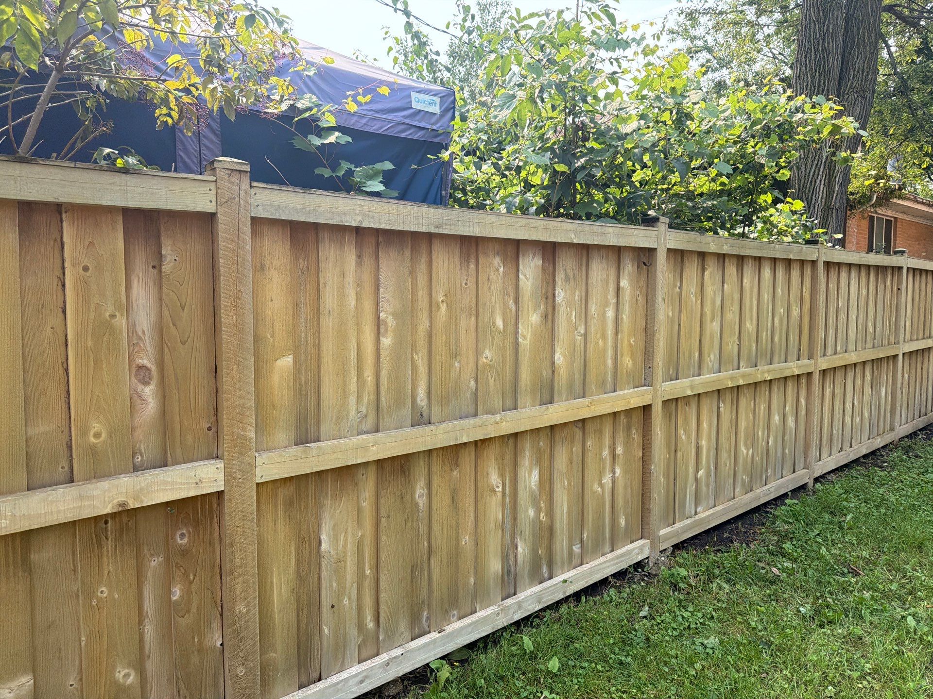 Wood fence cleaning and sealing by Northern Power Washing LLC.