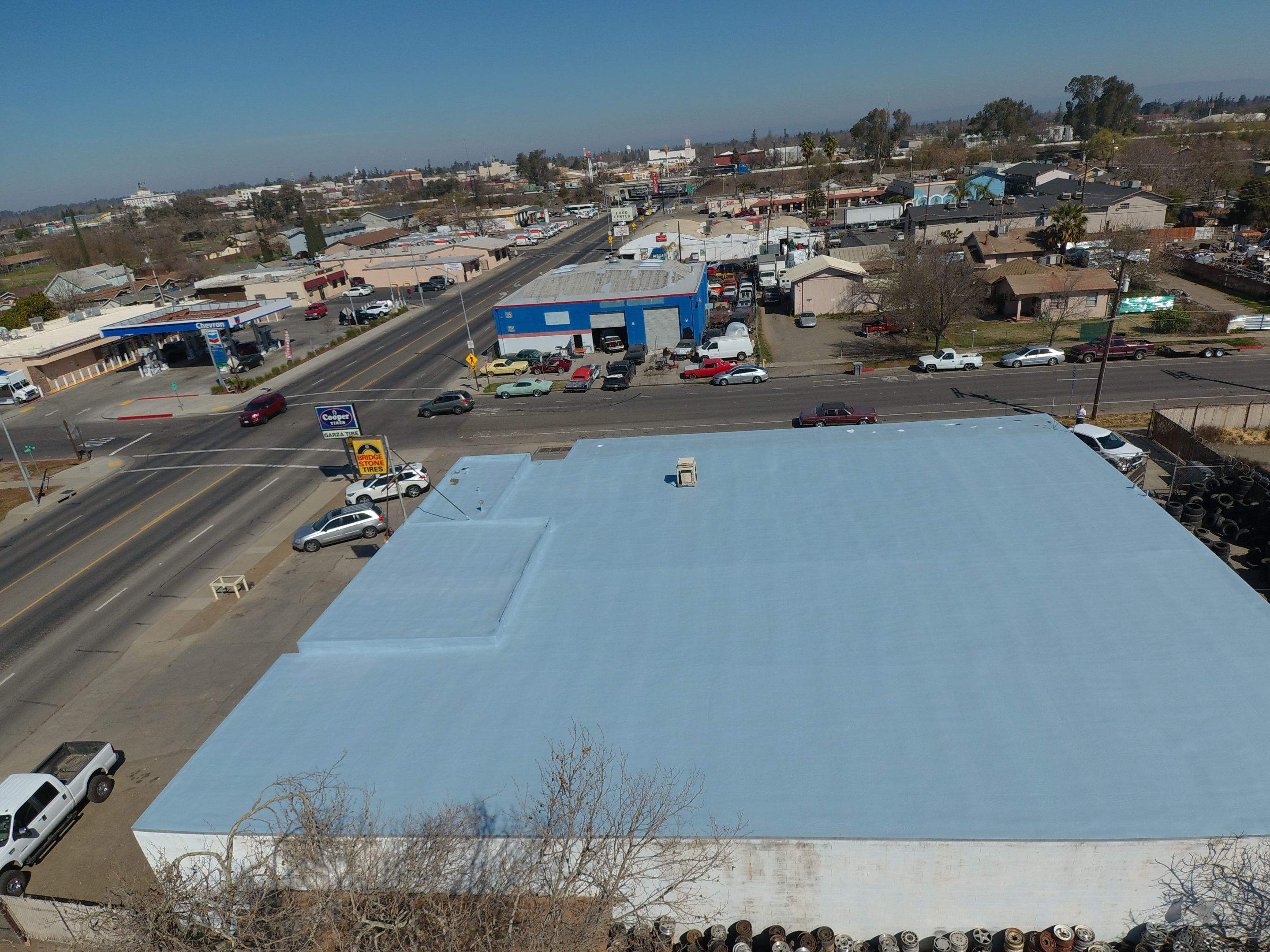 Spray foam and coatings using Conklin Benchmark/PUMA XL coatings and spray foam by Straight Edge Roofing Inc