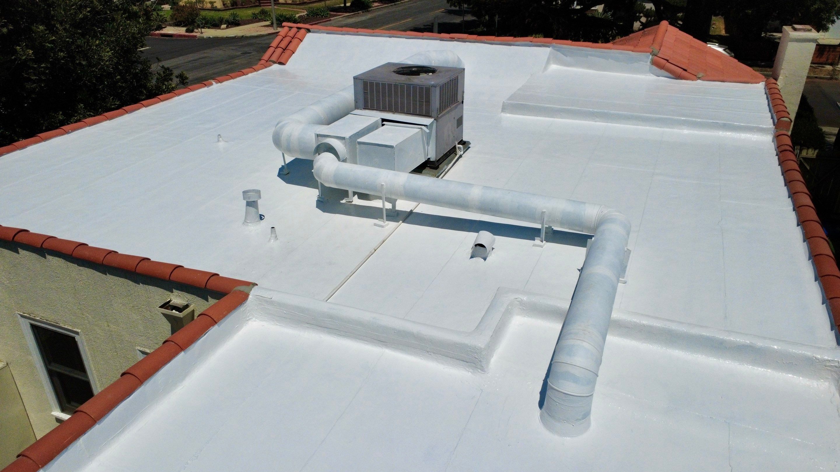 Tile Reset and Silicone Membrane Installation by Hull Brothers Roofing