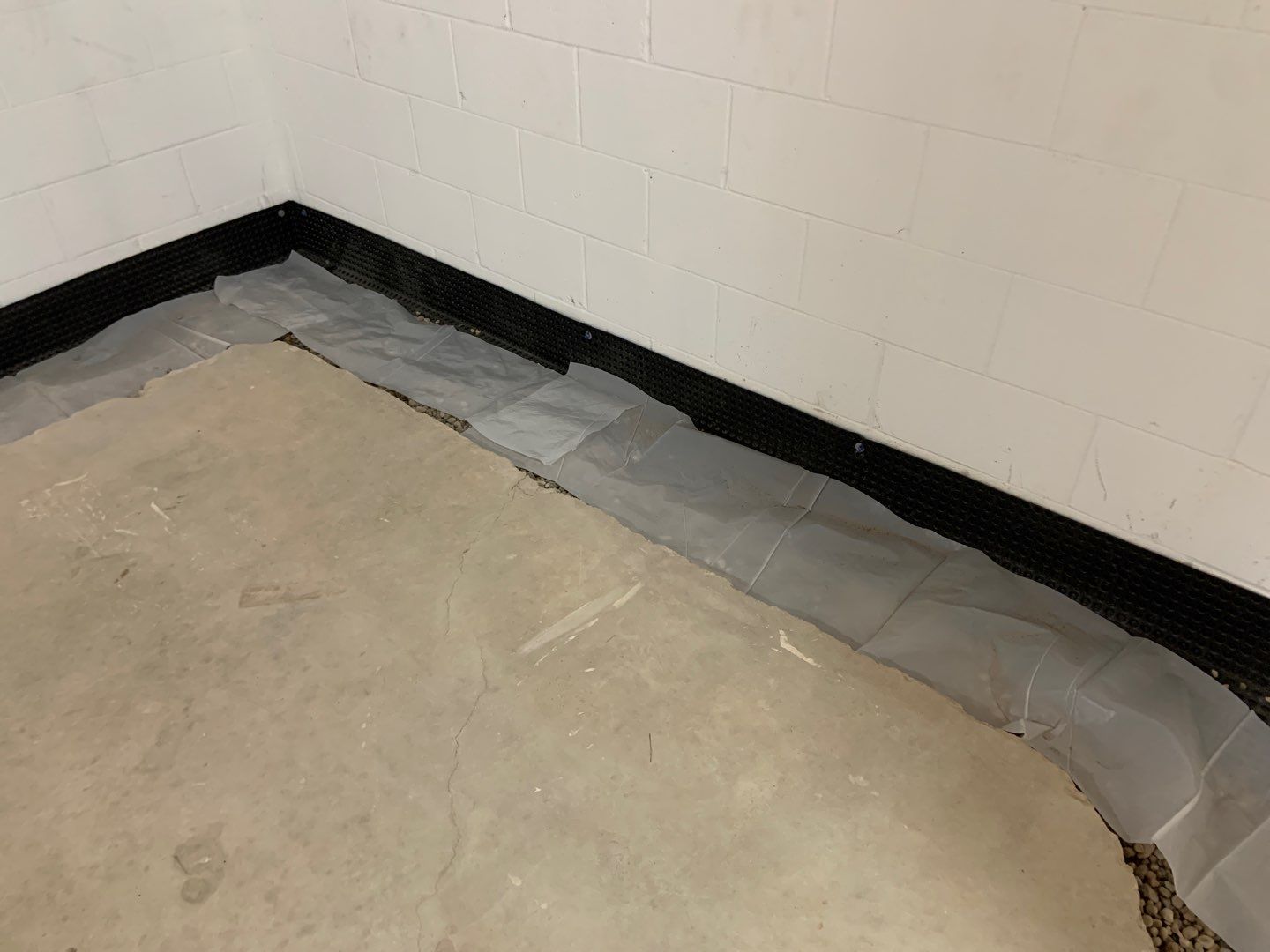 Correcting an Improper Installation for Alan in Chanhassen by Waterproofing Northeast