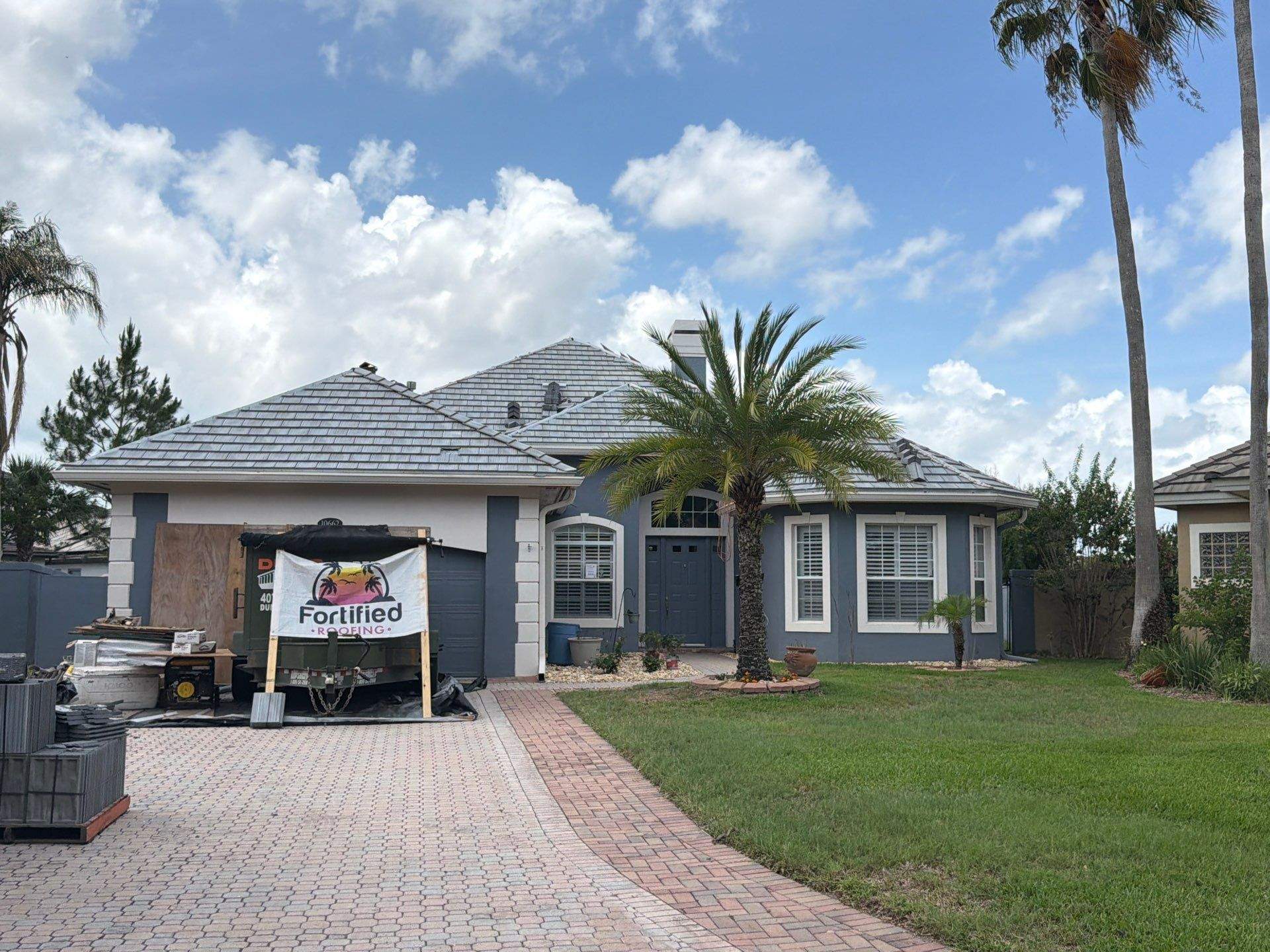 Winter Park Concrete Tile Roof Replacement and Chimney Flashing Installation by Fortified Roofing Solutions Corp.