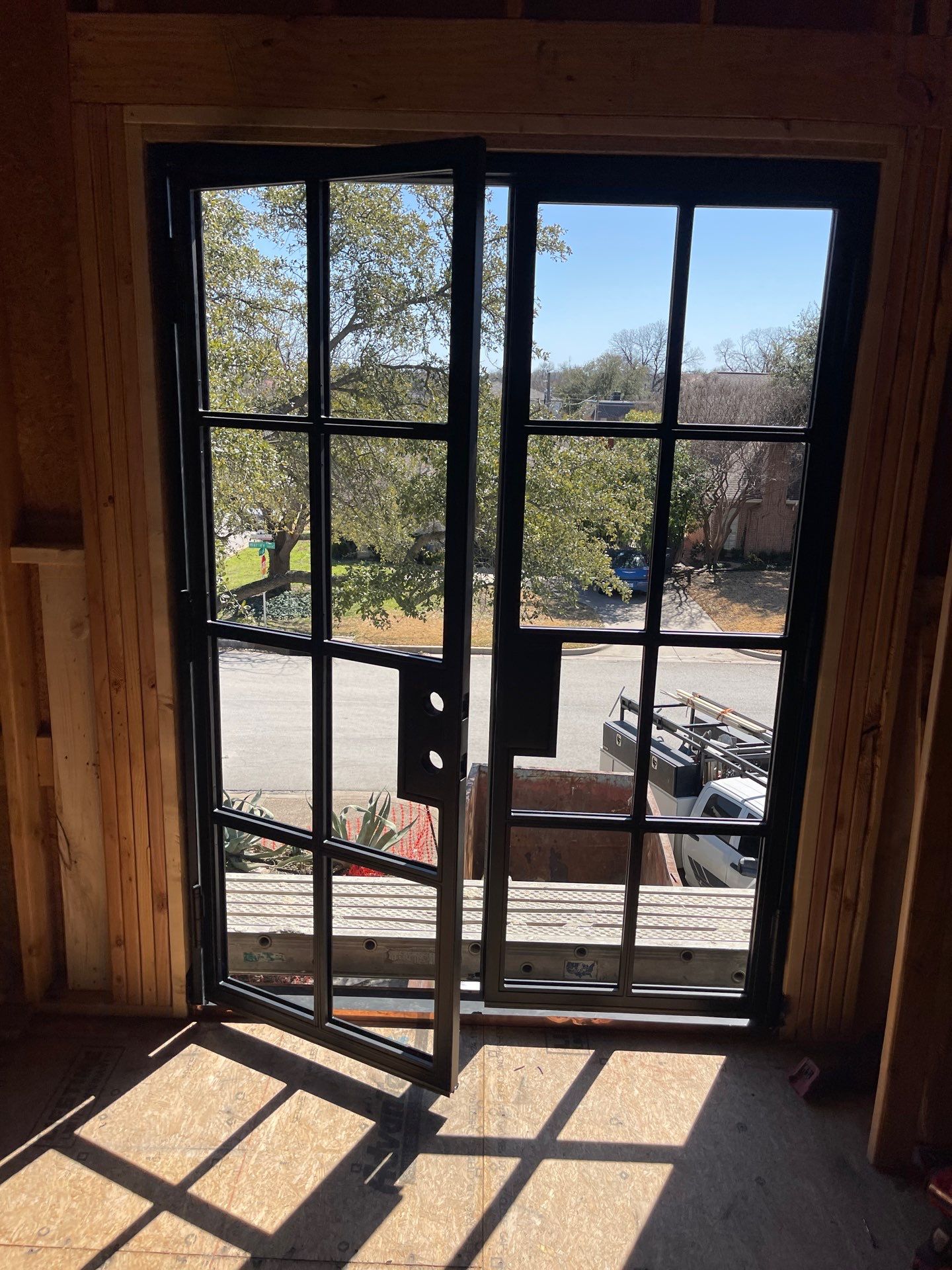 Arched Black Metal French Door Installation and Finishing in Fort Worth by Solara Custom Living