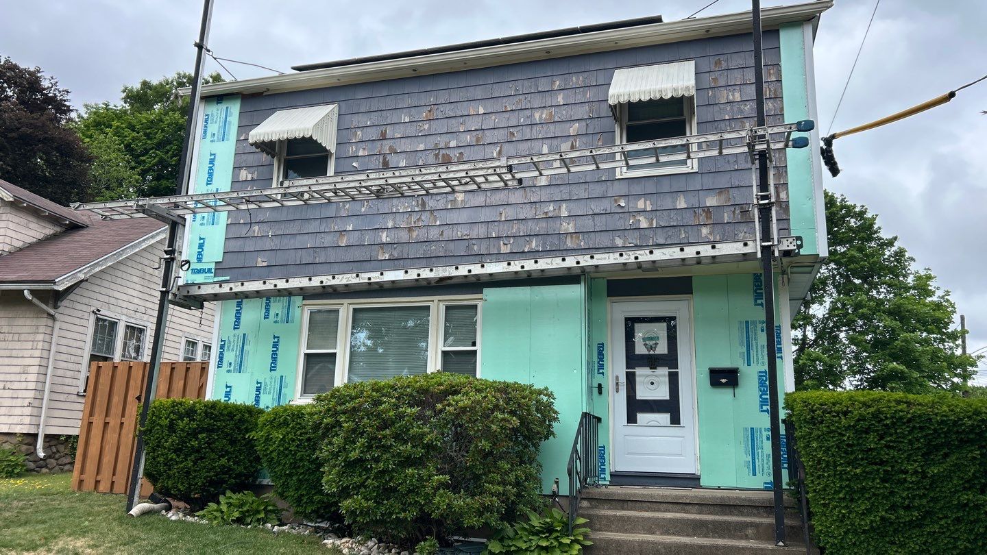 Siding Transformation with Cert Monogram D/4 x 12'6" clapboard, Wedgewood Blue by DiGiorgi Roofing and Siding Inc