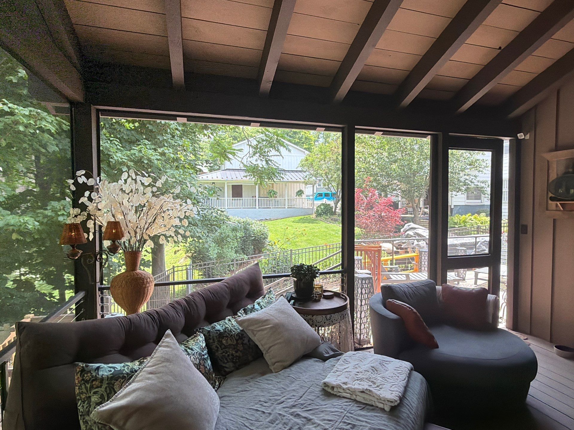 Custom Composite Deck with Stone Fireplace and Modern Cable Railing by Walnut Hollow Decks & Outdoor Living