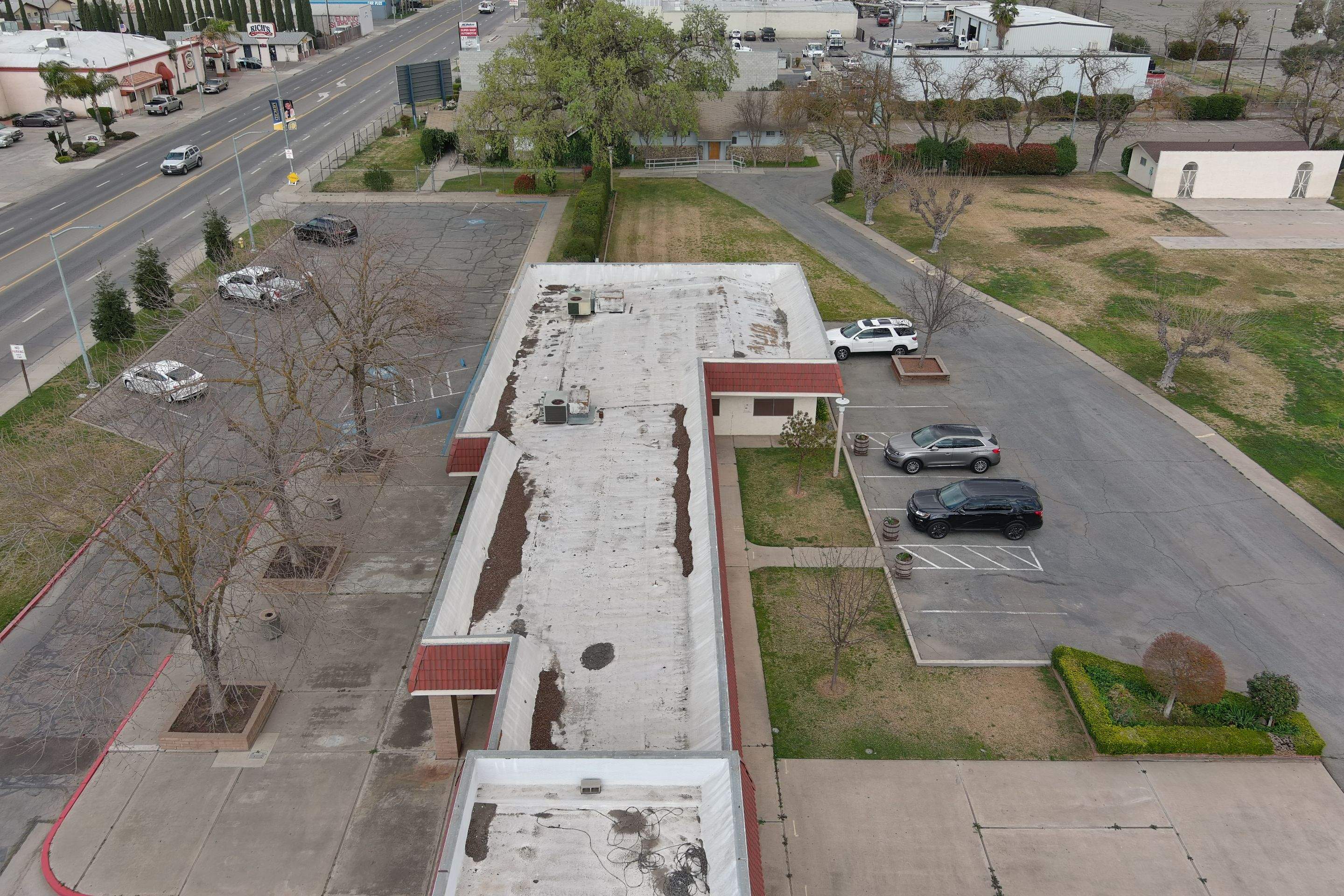Commercial Roofing Installation using General Coatings acrylic coatings and spray foam by Straight Edge Roofing Inc