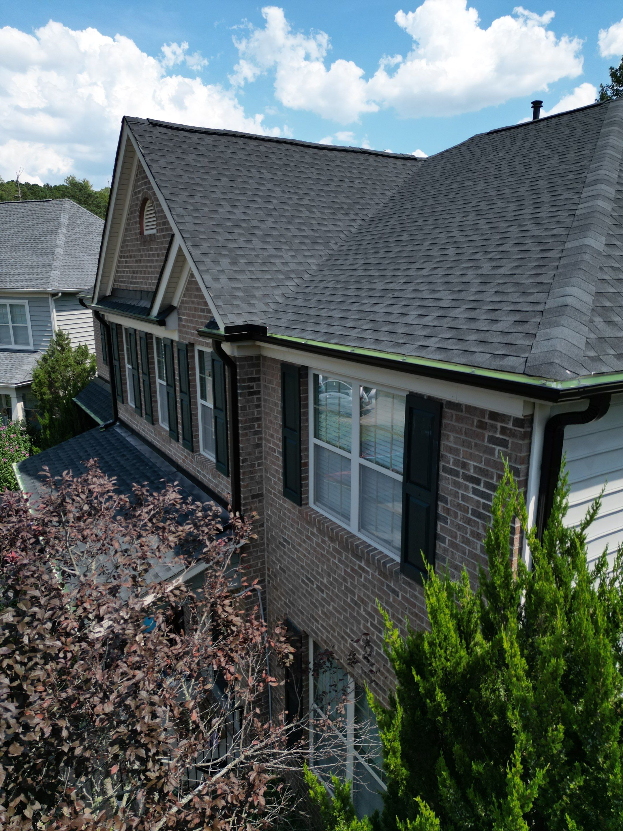Roof Replacment - GAF Timberline HDZ Charcoal with 5” black seamless gutters  by Pro Performance Roofing