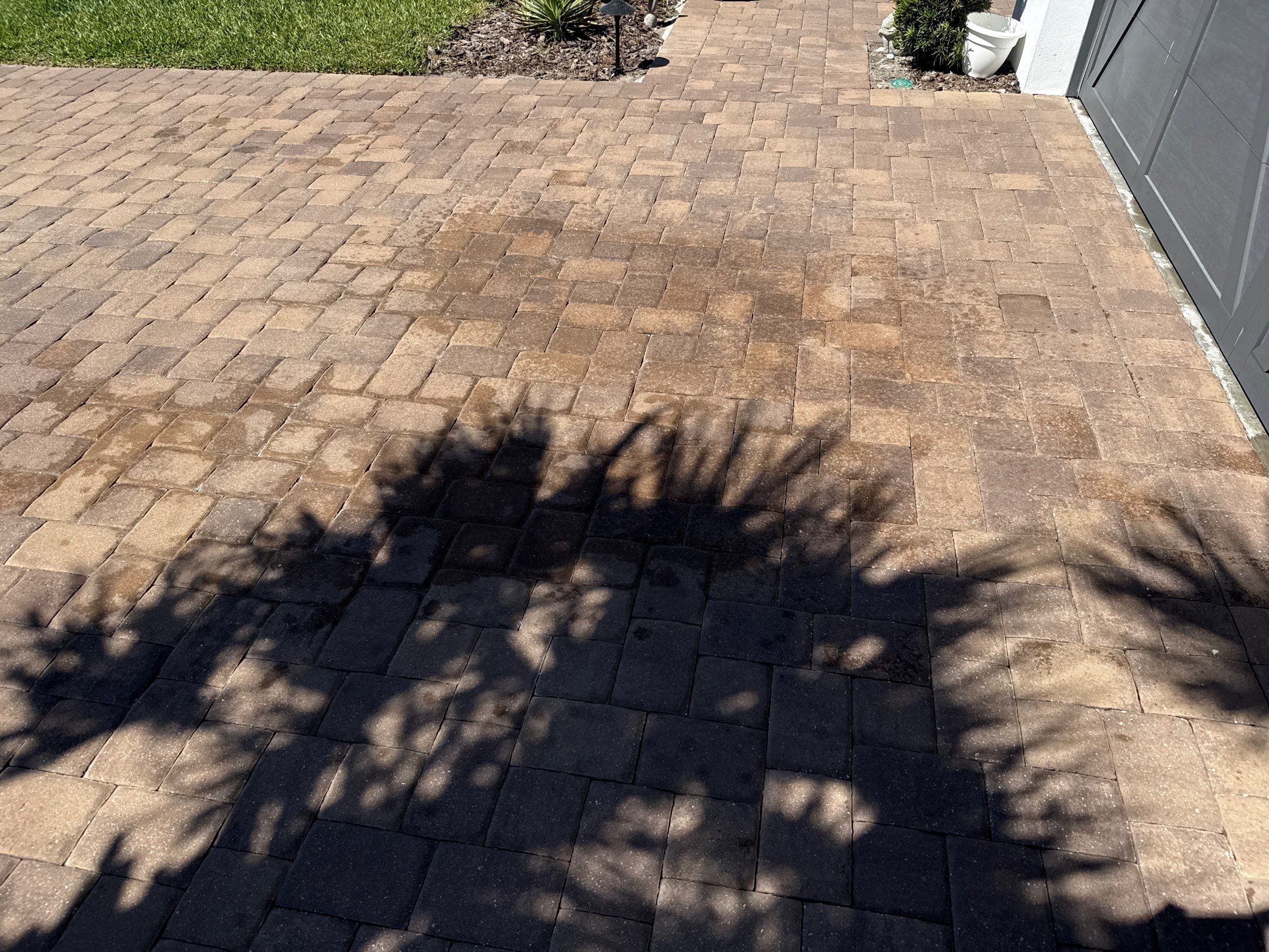 Oil Stain Removal on Paver Driveway | Esplanade at Artisan Lakes, Palmetto FL by Sunshine AquaWash