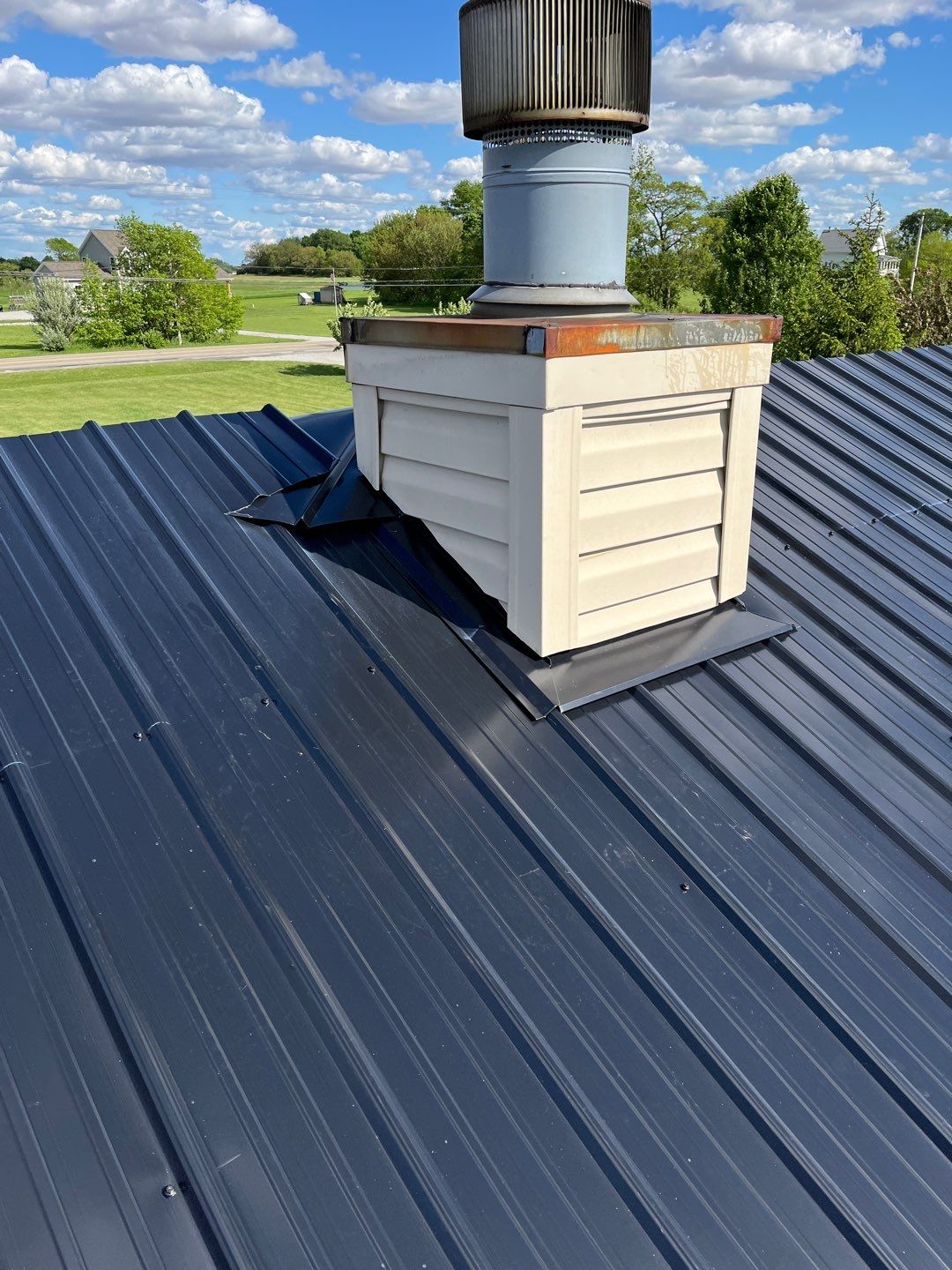 Residential Roofing Installation using Perfromance Panel Metal - Black by RoofX 
