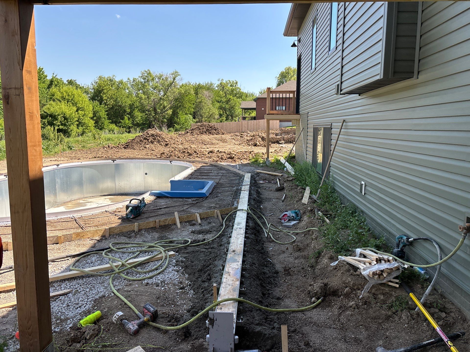 New Residential Construction - Paver, Putting Green, Pool by New Horizon Landscapes
