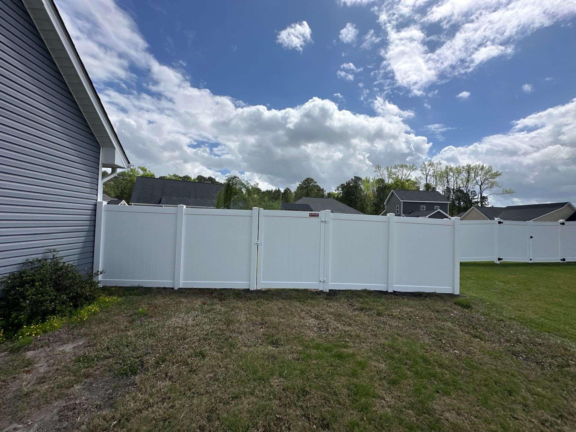 White Vinyl Privacy Fence Installation in Clinton by Superior Fence and Rail