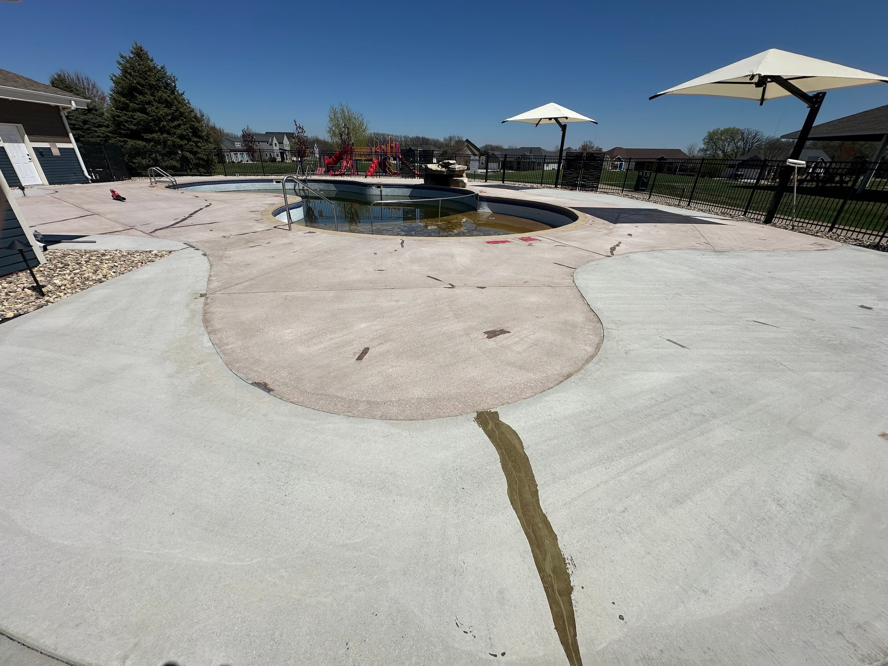 Arbors Edge Pool Deck Restoration and Textured Concrete Coating by Select Painting, Coatings & Garage Cabinets