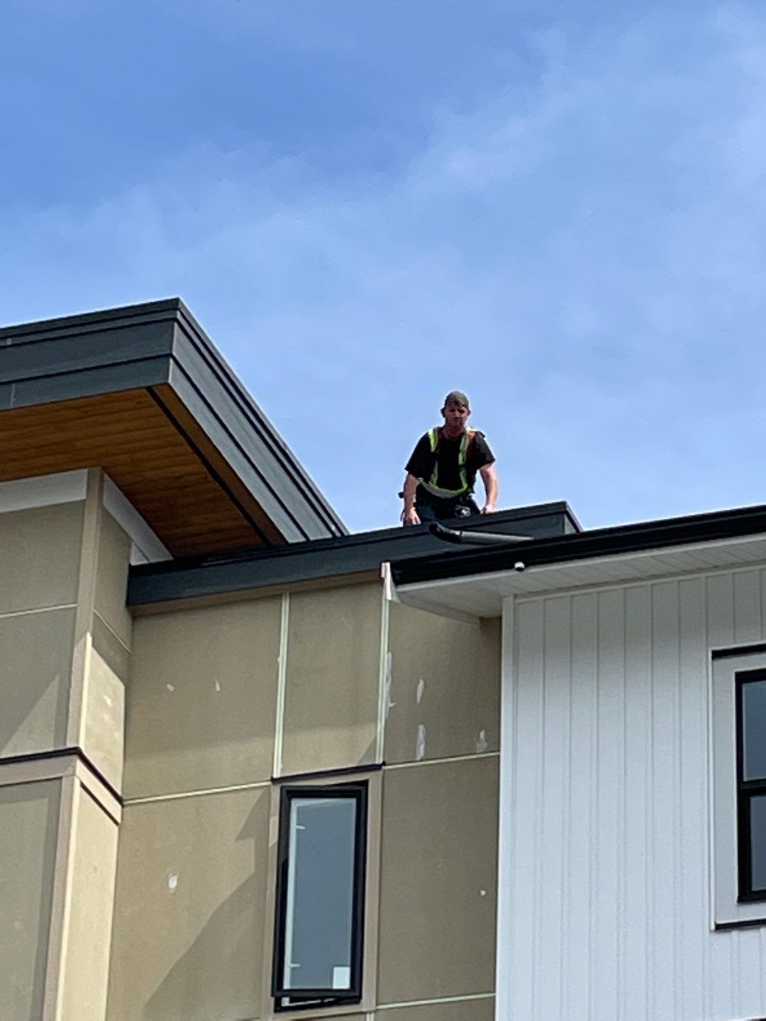 Large apartment with sbs, shingles and prolok metal  by Top Notch Roofing Inc